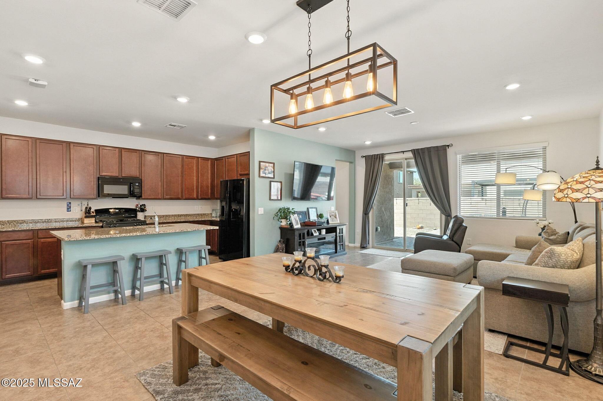 This rare find has it all--an oversized 2.5 car garage, modern finishes and a below-market price! Built in 2020 with upgraded tile flooring, granite counters, and warm tone cabinetry, this home is move-in ready. With a completely landscaped back yard, you can walk-in and start living without projects! Located in Rancho Sahuarita's master-planned community, you're steps from the pools, splash pad, parks and biking trails. With an extended garage, beautiful backyard, and community amenities right around the corner, this home checks every box. Opportunities like this don't last, call me for a private showing today!