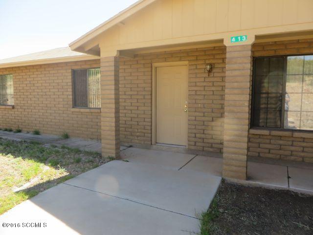 Lots of room around this delightful home. Inside enjoy the polished concrete floors, Living rm + Family room with fireplace. Spacious kitchen with island, master bedrm with ceiling fan with lights, air conditioned & a large garage with cabinets. Large yard & huge covered rear porch great for family, pets, entertaining and has a garden area, beautiful vegetation & views. Home sits back from road & has chain link fencing. Adjoining Lot 71 is available for sale.