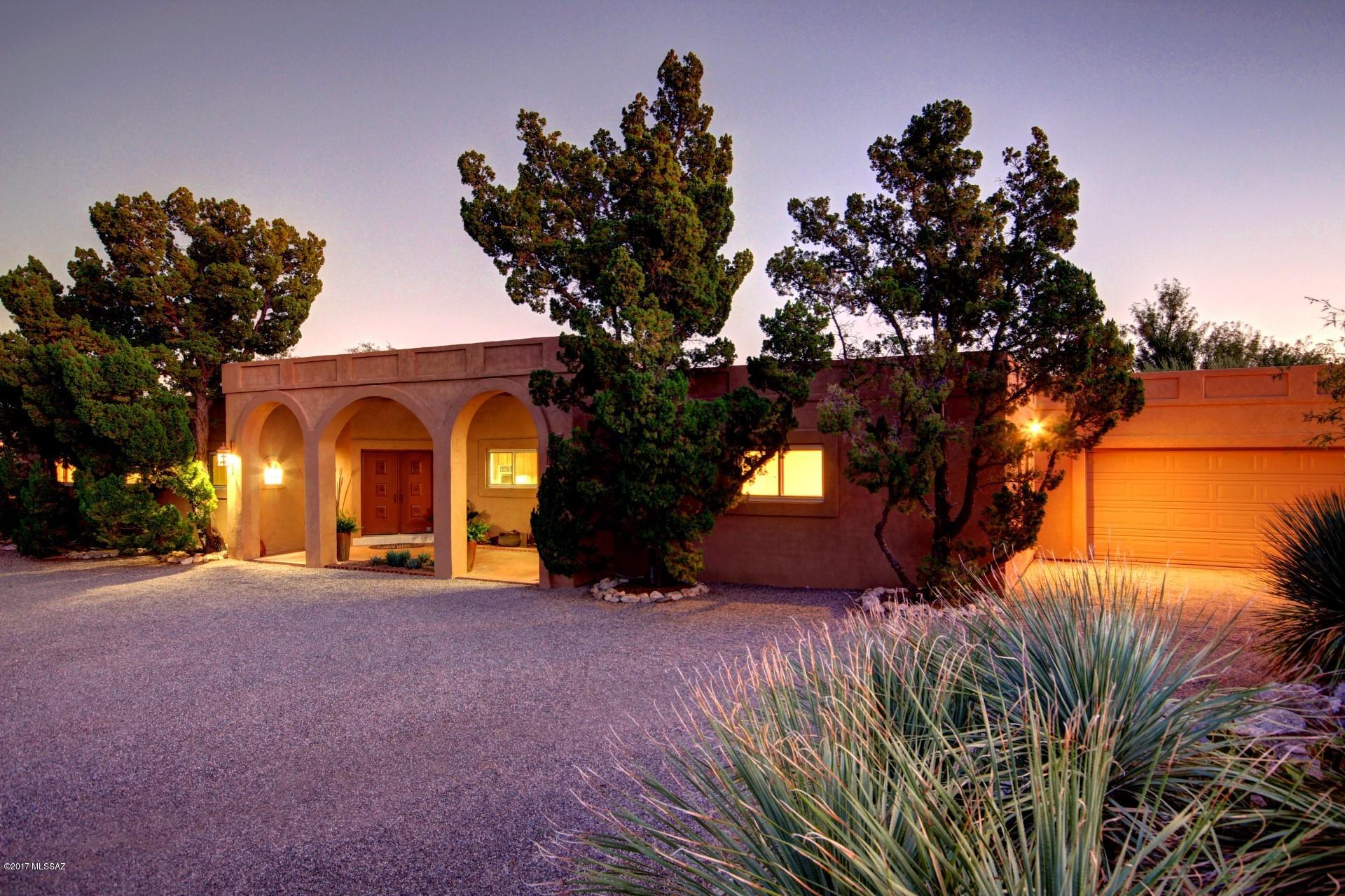 Below Appraisal ( 2015 - $854K ) Coronado Foothills Territorial with city and mountain views. Well maintained,  Traditional design has living, dining, & family rooms, 4BR/3BA+ Office, ( Den or guest quarters- separate entrance )  perfect for home business. Two fireplaces, Alarm System, Energy efficient w/Triple pane windows & leased Solar panels. Pool & Hot tub, lighted TENNIS court or convert multi-sport area. HUGE extended patio w/wood beams to enjoy outdoor living. Gorgeous Catalina Mountain & City light Views. Highly rated District 16 schools. House currently has TWO lots merged, see sister listing for purchase of home on single lot, or separate land lot listing. Great Investment potential to split off lot for extra $. Tennis Court on this parcel will convey in current condition,
