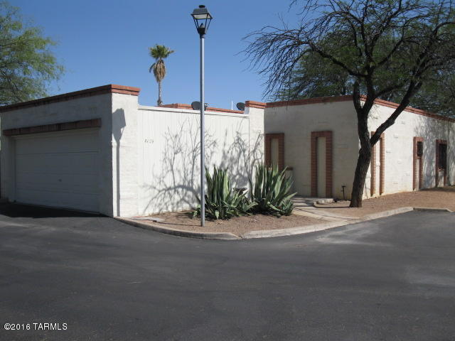 Looking for a home or a rental investment?! Look no further! This 1 story townhome offers Quality Masonry Construction with 2 Car Garage.  End-unit is located inside the complex within walking distance to the Community Pool. A Charming entry leads into a light & Spacious Great Room. Dining area is located off the retro kitchen. 3 large bedrooms in a Split Floor-plan.  Walk-in shower off the master. Guest bath with tub. Laundry closet & linen closets in the hall. More storage in the garage.  Well-maintained home has New Carpet, Neutral Tile and Fresh Paint throughout. Roof was just recoated. Master & Guest Bathrooms refurbished. Easy access to University, Banner Health complex, Downtown, Rillito Walkway & Shopping!