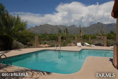 Well maintained 2-story home with 4 bedrooms and 3 baths.  Amazing mountain views from the private backyard and master suite patio.  No carpeting on main level and newer carpeting upstairs.  Lots of storage room.  Washer/dryer included.  Open enrollment for school district 16. Beautiful community pool for your enjoyment. Call today for a showing!