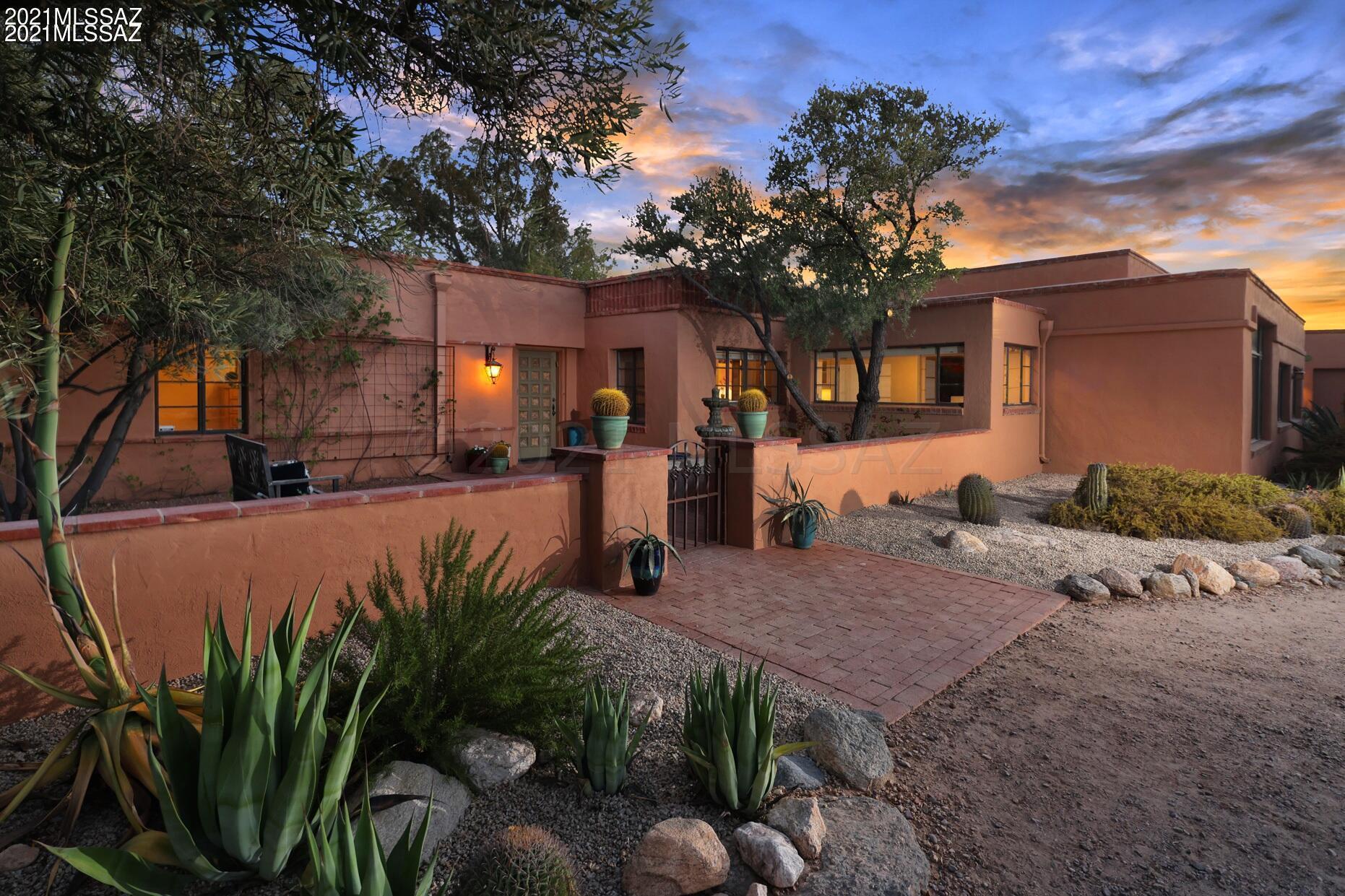 Timeless old world charm and elegance abound in this fabulous Joesler nestled on lushly vegetated 2+ acres in the heart of the foothills creating a very special oasis with phenomenal city, mountain and sunset views.  This character filled masterpiece boasts high wood beamed ceilings, classic Saltillo tile floors, enormous patio with original brick work, and resort style salt water pool with complete privacy.   Luxurious master offers N/S facing views, separate patio, and updated bath with clawfoot soaking tub, two pedestal sinks, walk-in shower and vintage styled hexagonal tile. Kitchen boasts a 6 burner Viking gas range, Subzero fridge & opens into living & family rms. Natural light pours in through wall to wall picture windows to enjoy the cityscape w/coffee and twilight with cocktails.