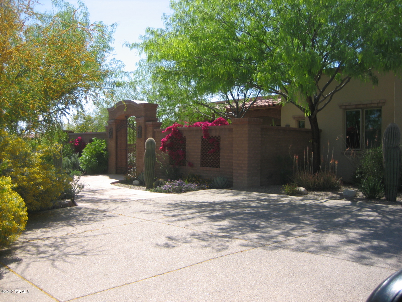 SOLID WELL CRAFTED MASONRY HOME W/ 5 BEDROOMS 6 BATHS ON 1.O2 ACRE LOT IN
GATED LA PALOMA ESTATES. THIS HOME BOASTS A PRIVATE COURTYARD ENTRY W/CUSTOM IRON GATES, SPACIOUS SPLIT
BEDROOM FLOORPLAN, HIGH BEAMED CEILINGS, FORMAL AND INFORMAL LIVING AND DINING, CHEF'S KITCHEN W/VIKING PRO
APPLIANCES (2 DISHWASHERS), CUSTOM CHERRY CABINETRY, PELLA WINDOWS, 8 FT DOORS AND NO STEPS.   DEEP
COVERED PATIOS, POOL & SPA, BBQ, OUTDOOR SHOWER PROVIDE TRUE ARIZONA LIVING. GREAT HOME FOR FAMILY AND
ENTERTAINING. FLOOR PLAN UNDER DOCUMENTS.  OWNER/AGENT