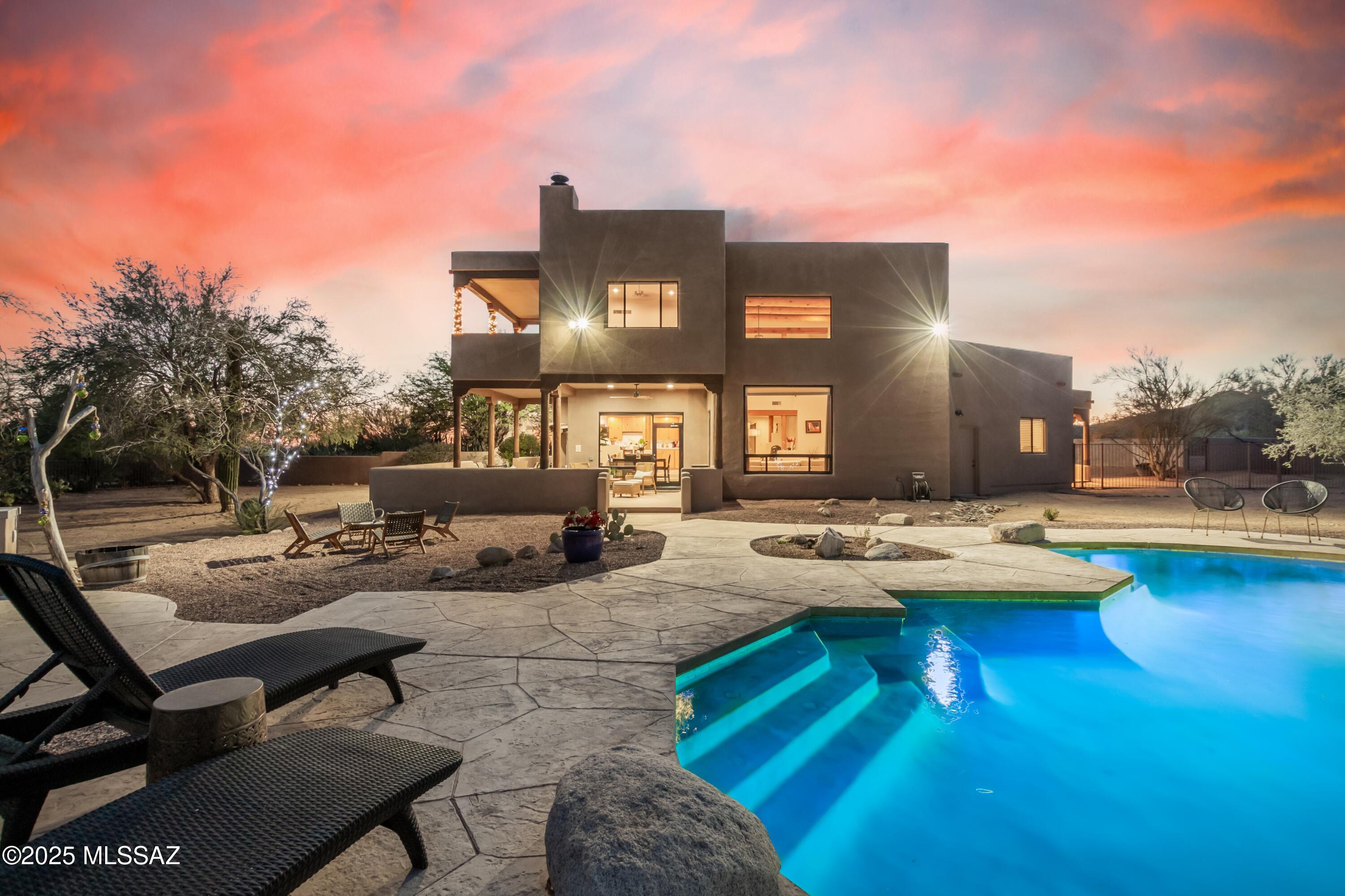Nestled on 3.31 acres in a private enclave of $1M+ homes. SERENE saguaro-studded desert landscape. PANORAMIC MOUNTAIN VIEWS + CITY LIGHTS from your primary suite. HORSE PROPERTY by zoning, NO HOA, BRING YOUR TOYS. This GORGEOUS custom-detailed estate boasts 5,429 sq ft under roof w/ 3,495 sq ft living area. SOARING 20ft living rm VEGA BEAM CEILINGS! Primary suite is entire 969 sq ft upper-level w/ fireplace, walk-deck, jetted tub, ample closets. Find serenity while stargazing around your fire pit, walking private trails w/ benches, or meditating at your own Stonehenge! Take a dip in your POOL & unwind, recharge, & enjoy life. Extra deep 3-car GARAGE w/ oversized doors + large WORKSHOP. NEW flooring, quartz kitchen counters, roof warranty. RANGE PRICE from $1,175,000 to $1,199,000
