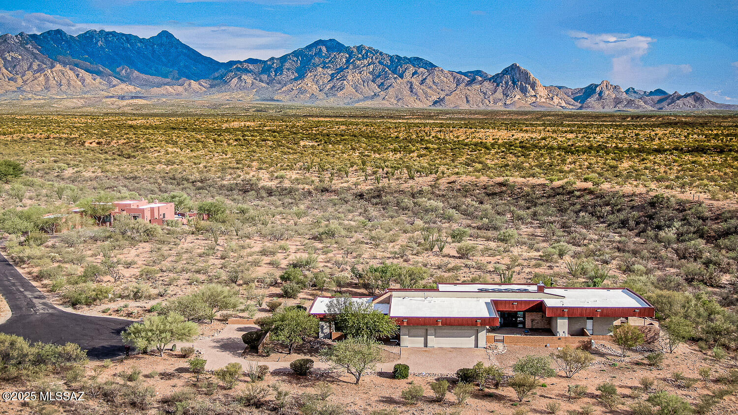 Southern Arizona's Iconic Contemporary Masterpiece. As the late great ESPN anchor Stuart Scott used to say, ''Cooler than the other side of the pillow''. A flawless fusion of bold architecture and desert beauty and yes, as cool as it gets! 360º unobstructed mountain views, polished concrete floors, tongue and groove pine slat ceilings (transitioning to the covered patios and eves), adobe brick walls, floor to ceiling windows and sliders, electronically controlled window shades, wired for Smart-home control, soapstone and quartzite countertops, gas and LED lighted fireplace, newer split HVAC systems, tankless water heaters, salt water pool. Additional options exist via, generously discounted, purchase of adjacent 3.3 acre parcel under separate title. The list goes on but I won't.