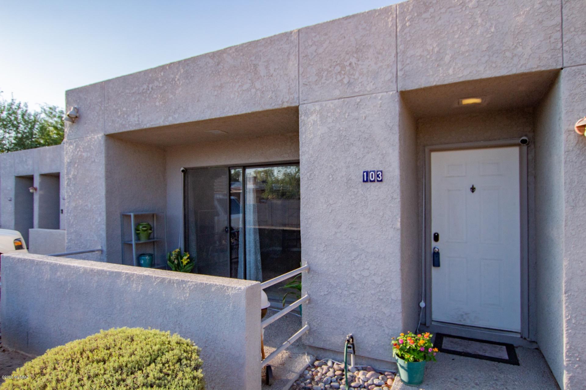 Fantastic Condo in a convenient location to U of A, Shopping, & more.  Charming courtyard for outdoor entertaining, soaring ceilings, warm palette, fireplace for those chilly AZ evenings, & spiral stairway to loft.  Tastefully remodeled w/granite kitchen counters, breakfast bar, & plenty of wood cabinets. Plush carpet in all bedrooms, ceiling fans, ample closets, & 2 baths. Spacious loft area w/endless possibilities. Do not miss a great opportunity to own a wonderful home.