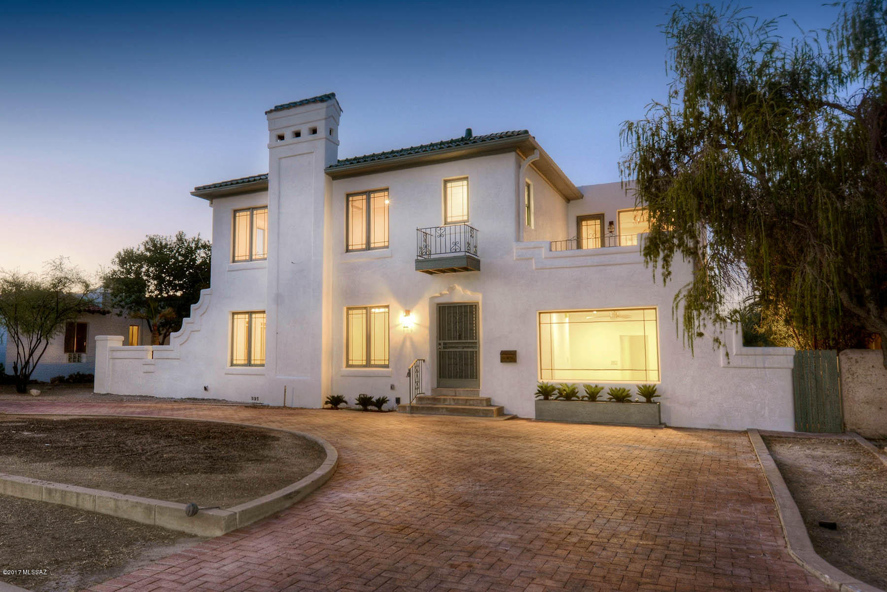 The Quintessential Spanish Mission Revival built in 1925.Beautifully restored & remodeled w/a kitchen & Den addition.Oak & mahogany hardwd flrs thruout,Remodel offers;rewiring,re-plumbed,new HVAC systems.Downstairs includes;formal livingrm & diningrm w/adjoining patio.Arizona rm,Butlers pantry, laundry & 1/2 bath,kitchen has wood beamed & plank ceilings,all new Shaker Cabinetry,unique quartz counter tops,new SS appli & tons of storage & is open to a familyrm,Den & 3/4 bathrm plus studio.Upstairs has MSTR bedrm w/a FP remodeled 3/4 bath & walk in closet.2nd & 3rd bedrms have private bathrms. Large backyard has patios & off street parking in back & circular driveway out front.Walking distance to Himmel Park,Rincon Market,The UofA.A contributing property on the Historic Register!