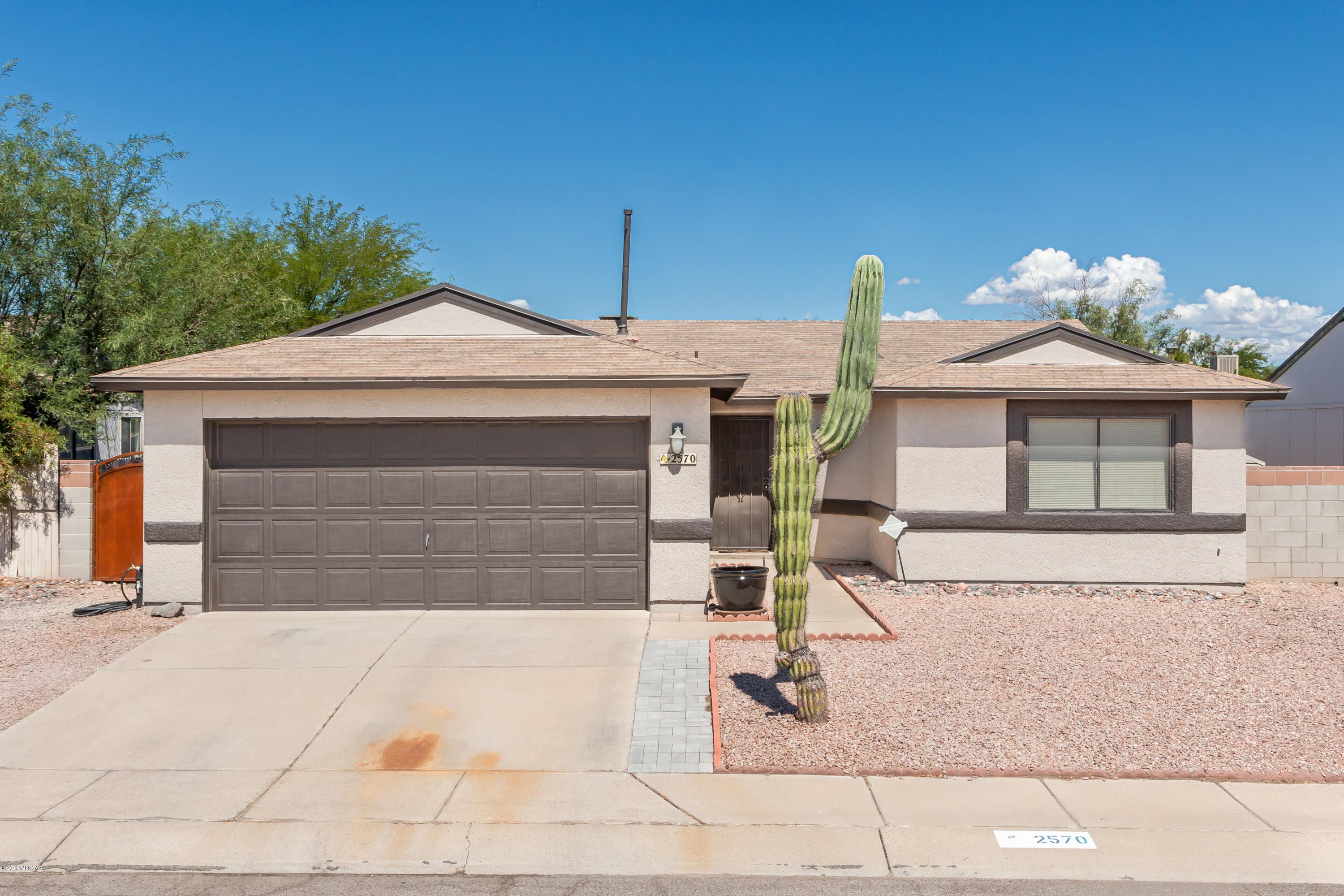 Updated, move-in ready, & located in the desirable NW Tucson. No Polybutylene here - Replaced 2019. Freshly painted interior & exterior with neutral color tones, vaulted ceilings that complement this light, open/split bedroom floor plan. Kitchen equipped with a gas range & sleek black appliances that can convey with the home. Additional upgrades include: Updated lighting fixtures throughout, beautiful wood blinds, water heater - NEW (August 2019), ceiling fans in all bedrooms, both full bathrooms have been remodeled with new tile flooring & tile surround shower/bath. The large back yard is fully enclosed and offers plenty of entertaining space, decorative gravel, storage shed, complete with orange and grapefruit citrus trees. Laundry room with newer front loading washer/dryer set that can also convey. Community offers a refreshing swimming pool, spa, basketball courts and more. All this home is missing... is YOU! Don't miss it - set up a showing today!