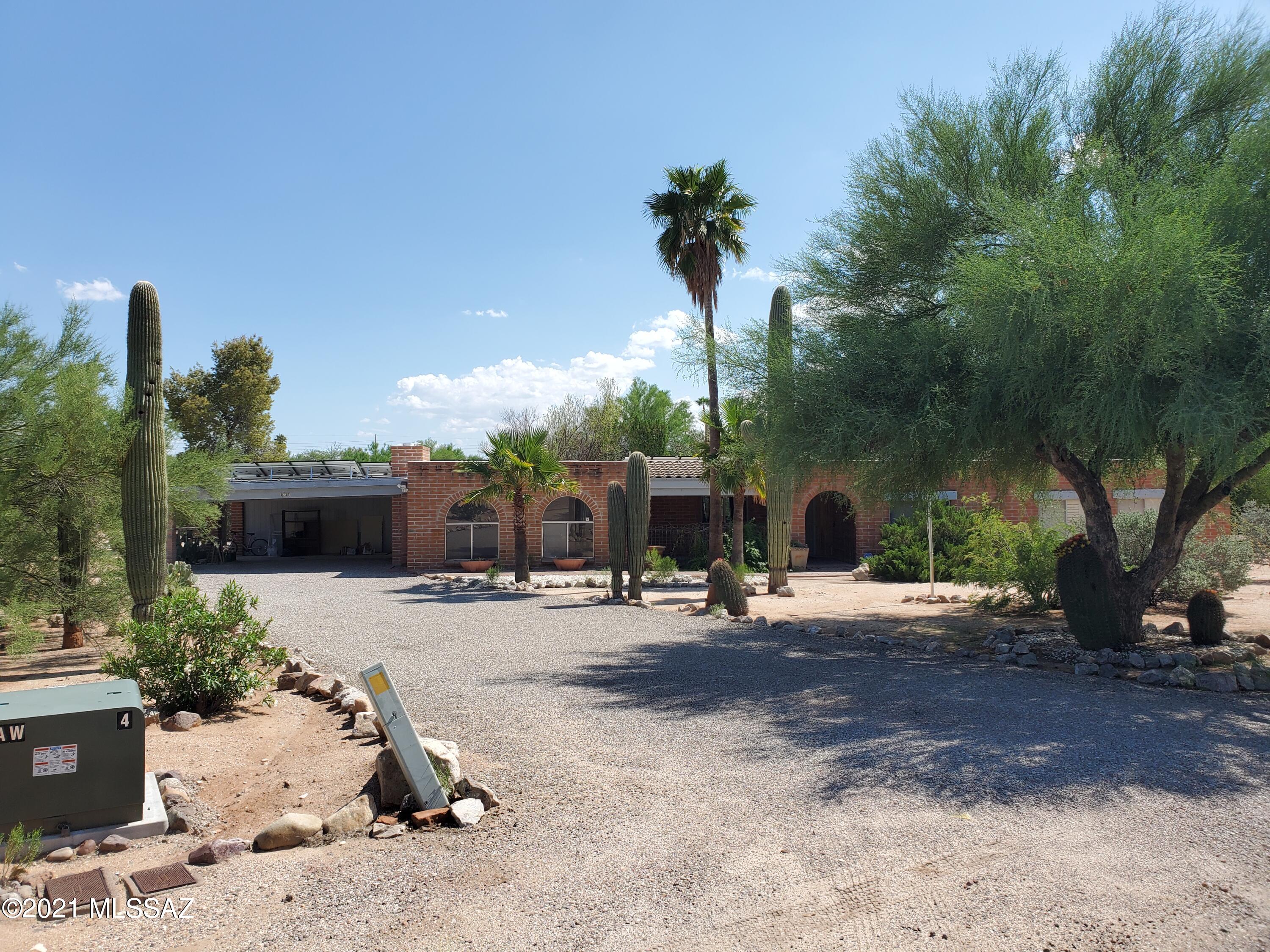 Nice home located in Casa Adobes on almost an acre.
