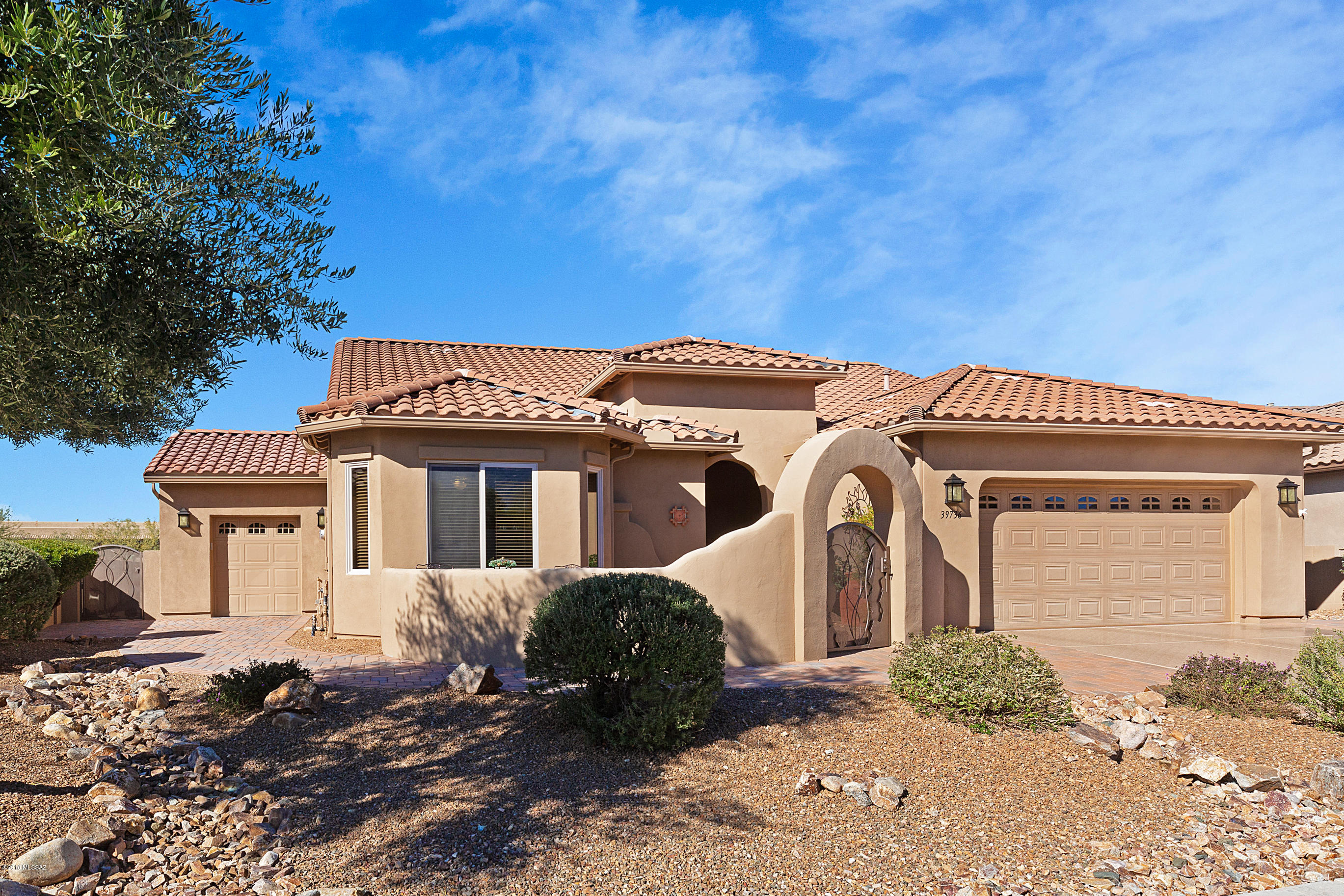 This home is ready for You. 2008 Artesa Floor plan with New Golf Car Garage & Added Separate Dining Room. Upgraded with all of today's required features such as large tile, stainless steel appliances & granite counters. Front & back yards landscaped with cobble stone pavers offering views of mountains. Private back yard fully fenced located on green space to separate you from neighbors. Kiva fireplace & built-in outdoor kitchen. Not too far from MountainView Clubhouse/Golf Course & Desert View Sports Complex. ''Retire Magazine'' chose SaddleBrooke as one of America's Top 100 best master-planned communities. Located at foot of Catalina Mountains with an abundance of community amenities, events, groups & traditions to fill every day. Desert View theater brings you cinema & live entertainment