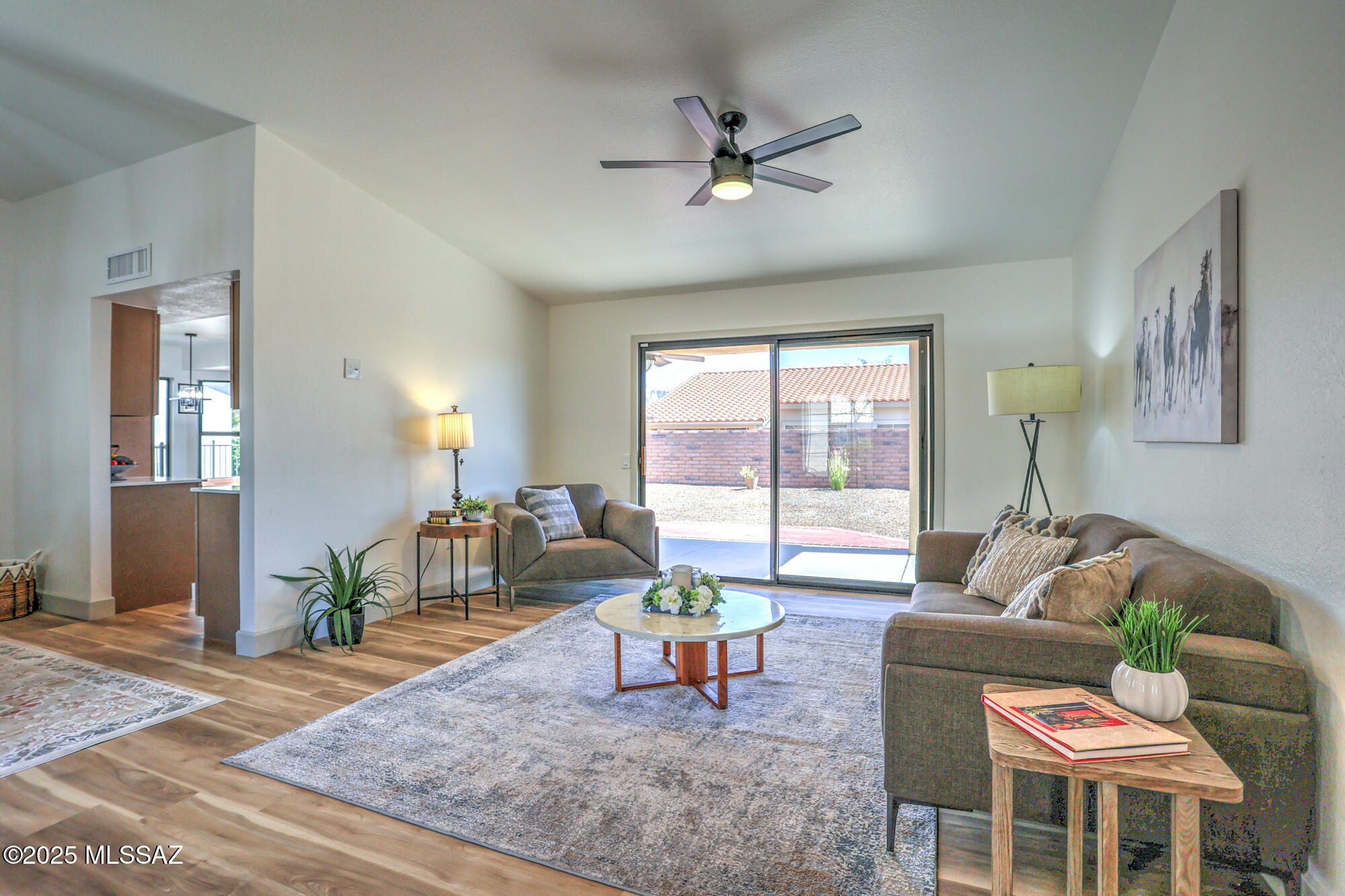 Seller will accept or counter offers in the range of $399,900-$414,900 .  Seller will pay off or remove solar.  Welcome to Sun City Oro Valley, a 55+ active adult community!  You won't need to lift a finger in this home, just move right in, everything is already done!  Remodeled to perfection in sleek modern style with new kitchen and baths, new LVP flooring, baseboards, doors and trim throughout.  Gorgeous finishes with upgraded wood cabinetry, quartz countertops and LVP flooring throughout (no carpet).   All electrical trim updated, fresh interior and exterior paint and new flat roof with warranty.  Large fully fenced yard with mature plantings  on auto irrigation enjoy the outdoors on front and back covered patios.  Garage finished with epoxy coating for continued easy care for years! Tour the community amenities with multiple clubhouse complexes, a large selection of clubs to join, 2 pools, spa, pickleball and tennis courts, exercise facilities and The Views Golf Course and restaurant complex! Live the life, meet your neighbors and welcome to Arizona!