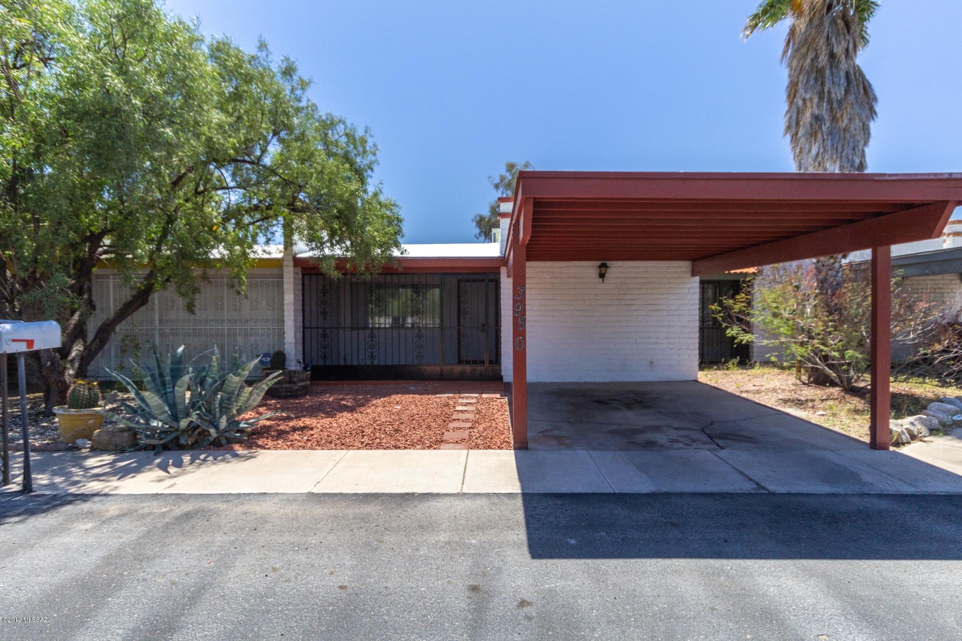 See this remodeled charming home with curb appeal!  This home boasts upgrades such as new hardwood flooring, a neutral fresh paint palette and spacious bedrooms!  The master suite provides a large walk-in closet! This kitchen hosts the ever popular stark white cabinetry and brand new countertops as well as new hardware.  Skylights and strategically placed windows allow for ample natural lighting.  This home offers endless possibilities in dining and entertaining.  Step outside and take in this backyard of updated fencing and a great brick facade corner wall.  This backyard is low maintenance or use it as your blank canvas to create your own oasis in the desert! This home is priced to sell - put it on your list to see today!