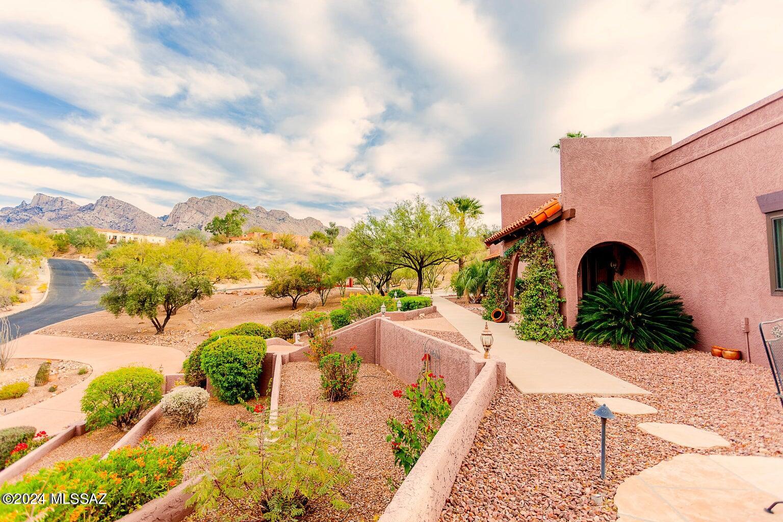 Welcome to your dream home on a .86-acre, elevated lot overlooking the  greens of the 10th hole at Oro Valley Country Club. This magnificent 4,152 sqft residence exudes elegance and sophistication at every turn, offering an unparalleled lifestyle of luxury and comfort. As you step inside, you are greeted by a grand foyer that sets the tone for the rest of the home. The interior boasts spacious living areas with exquisite finishes and meticulous attention to detail. Whether you're hosting intimate gatherings or extravagant parties, this home provides ample space for every occasion.
The gourmet kitchen is a chef's delight, featuring top-of-the-line appliances, custom cabinetry, and a large island perfect for meal preparation and casual dining. Adjacent to the kitchen is a formal dining room, ideal for hosting dinner parties with family and friends.
The master suite is a tranquil retreat with a luxurious ensuite bathroom and a private balcony offering views of the Catalinas and the County Club. Additional bedrooms and bathrooms provide comfort and privacy for guests or family members.
The outdoor living space is an entertainer's paradise, featuring a sprawling patio, a sparkling pool, and meticulously landscaped grounds. This outdoor oasis will impress whether you're lounging poolside with a refreshing drink or hosting a barbecue under the stars.
Take advantage of your opportunity to own this exquisite property and create memories of a lifetime in your private paradise.