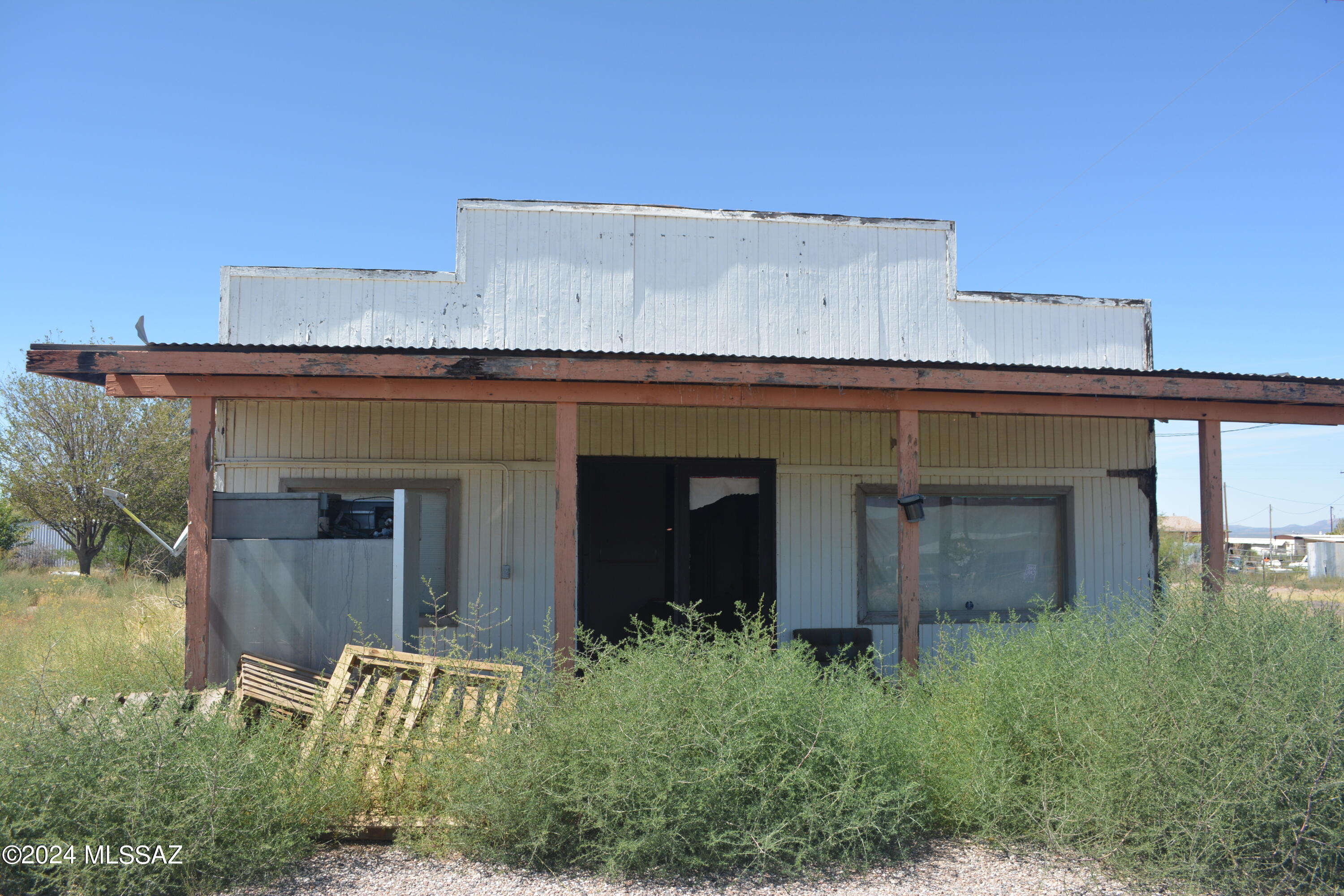 Investor's Dream Opportunity! This multi-zoned property, once a convenience store, restaurant, beauty shop, and office, is ready for your vision. Located on a spacious .4-acre corner lot, the possibilities are endless. The existing manufactured home needs significant TLC or can be removed for a fresh start. Whether you're looking to restore, rebuild, or repurpose, this property offers incredible potential. Don't miss out on this versatile investment in McNeal!