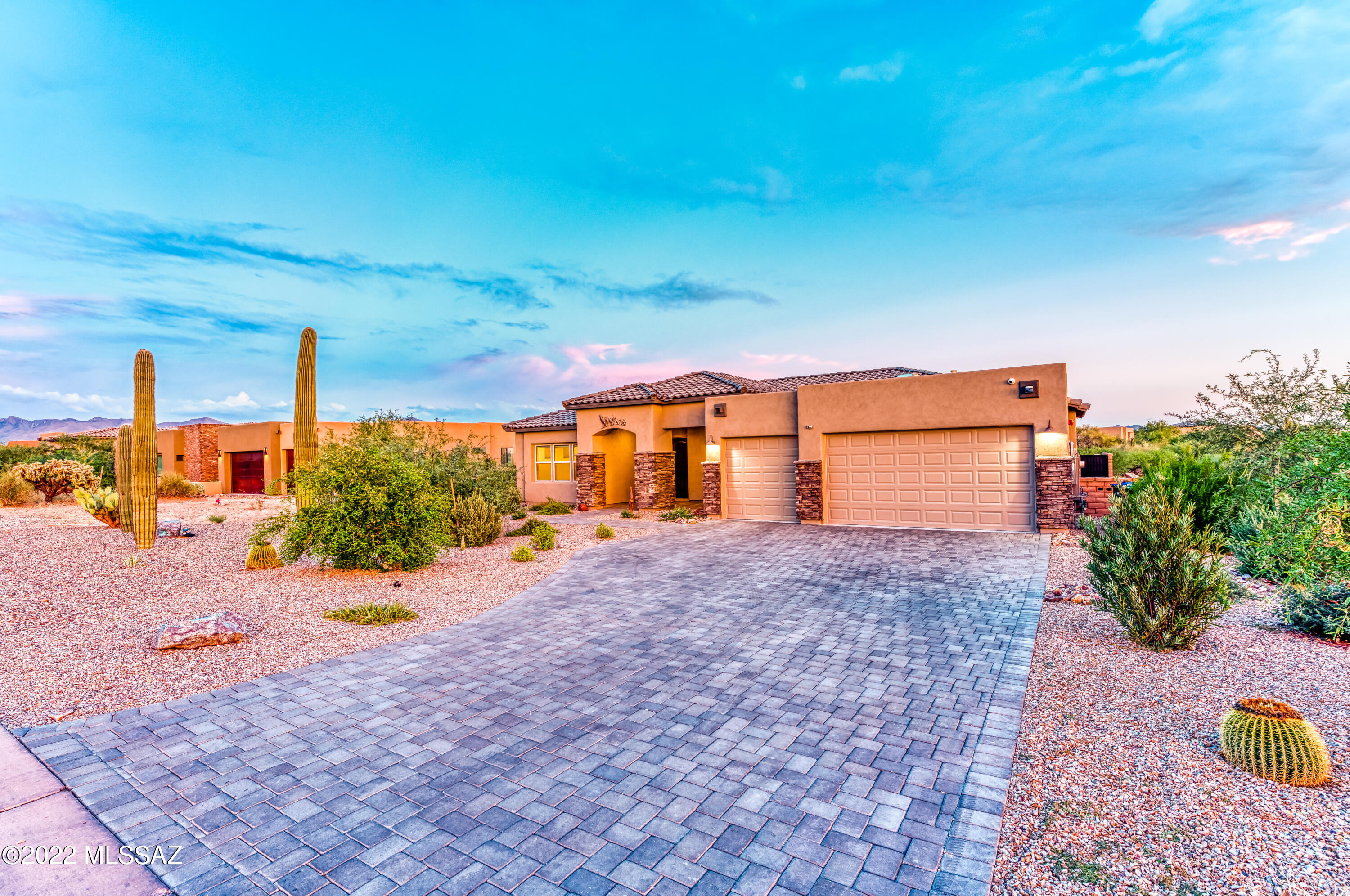 This Masterpiece in Stone House features majestic mountain views from every room and a plethora of upgrades with efficient energy use in mind. Upgrades include bathrooms with extra cabinets and jacuzzi tub in owner's suite, upgraded painted kitchen cabinets, two foot extension in garage and zone AC. Exterior upgrades consist of owned solar panel system, sun shades, upgraded landscape with thousands worth of Saguaro cacti, artificial grass, self-filtrating cleaning pool with sunbather steps and natural gas line for the grill.  Tech upgrades entail the family room wired for upgraded modern surround sound, all rooms setup with tv mounts, Cat 6 wiring terminated in flex room, hard wired exterior security cameras, internet ready and internet connected Big Ass Fans brand ceiling fans, 400 amp electrical service, dual 240v 30 amp outlets in garage for welding, ev charging...