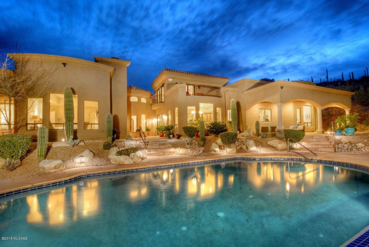 A Special Retreat - Absolutely Fabulous Views overlooking the entire Tucson Valley! See all of Tucson's Mountain ranges from your private backyard. City lights at night! Peaceful and Relaxing! Stunning custom home totally upgraded with the very best of all. Relaxing pool featuring views of the Saguaro studded natural areas below! Very close to the University of Arizona, Banner Hospital, downtown dining and shopping. Desert Museum, and much more. Featuring 4 bedrooms PLUS 2 offices! Soaring ceilings, solar power, awesome kitchen with plenty of room for entertaining! The best of everything! Solar System owned! Call for an appointment today!