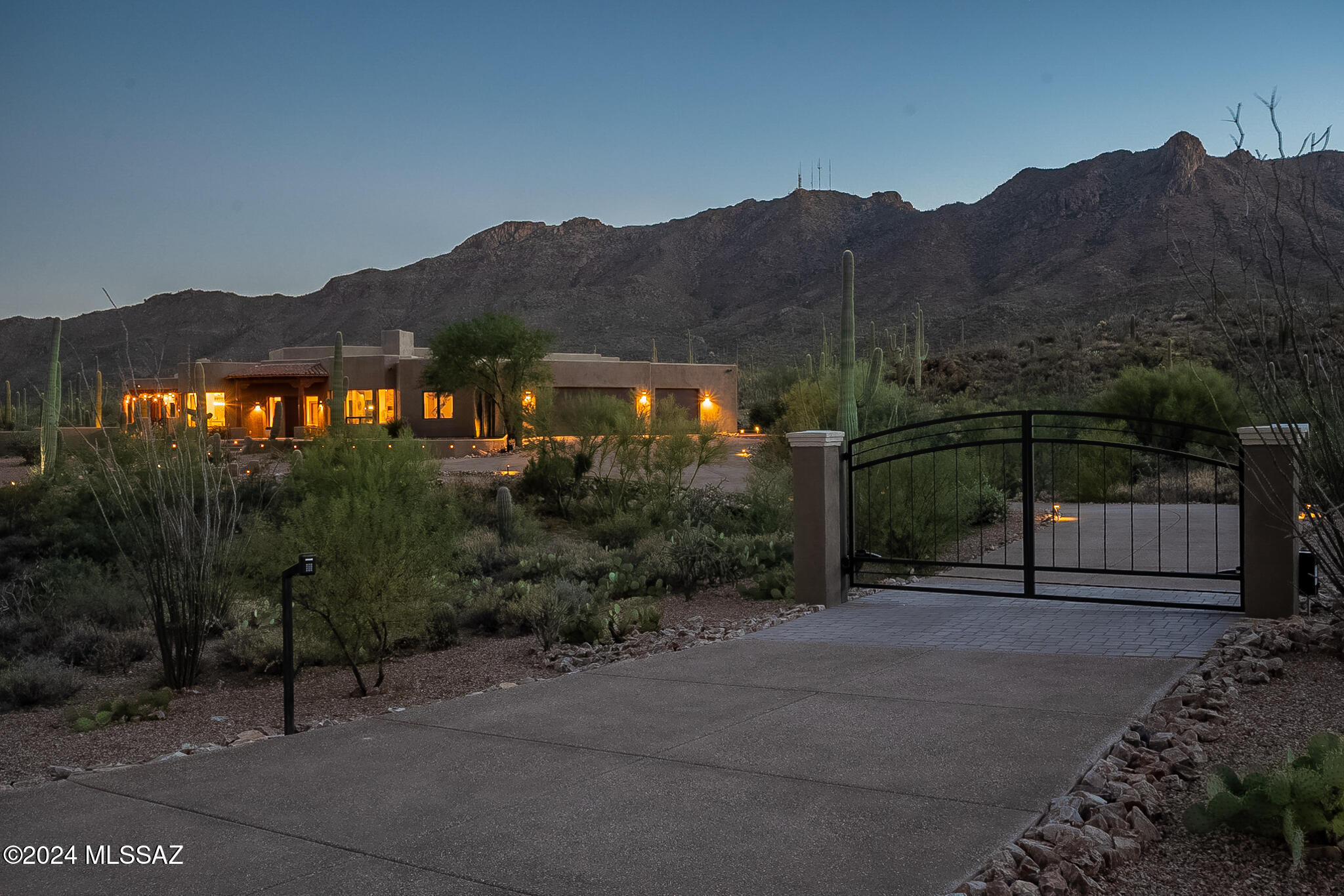 Located on a secluded, nearly 4 acres of rich Arizona beauty, you'll find this custom built 4-bed, 4-bath. Stepping inside will have you awestruck as you peer through the massive window which will give you your own majestic mountain view. Entertaining will be a breeze in this 3,810sqft home with its endless features. The open floor plan will give quick access to the granite countertops from kitchen to bar. Your private desert oasis features a spa flowing over a waterfall into your pool where you can boast the finest views. Take a quiet evening in, sitting next to your second fireplace in your master bedroom which has an enormous walk-in closet and luxurious master bathroom. Even the additional bedrooms feature views and their own porches to take in those famous Arizona sunsets.