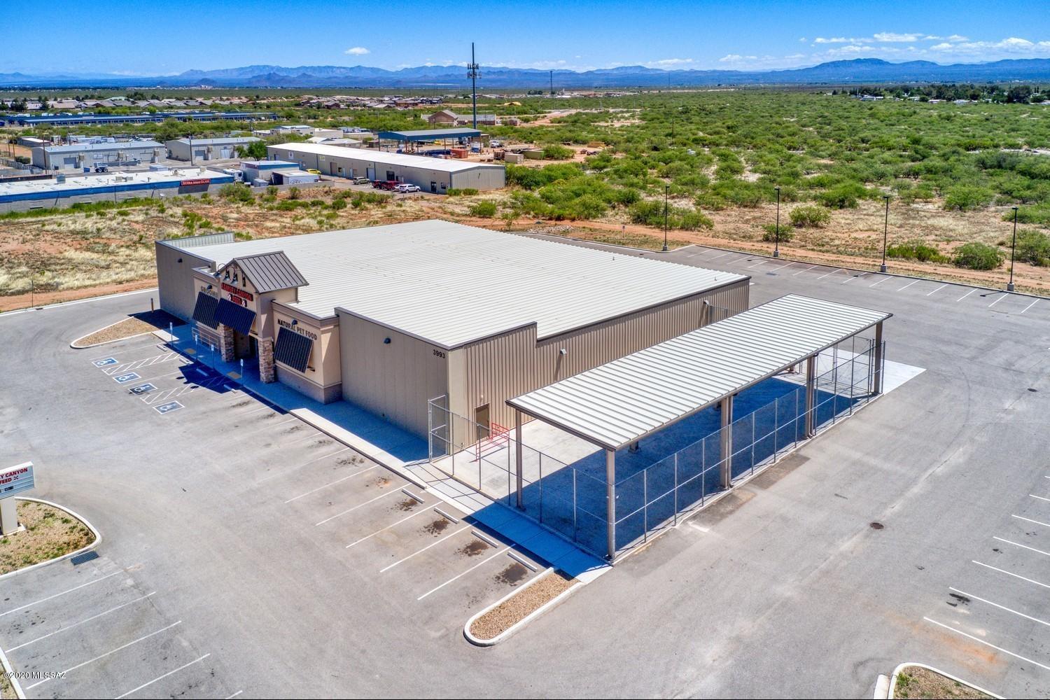 Strategically located South of Sierra Vista with close access to Mexico's boarder on the route to Benson/Douglas.  Quality built construction could have a multitude of uses including retail such as super market, farm and ranch feed store, ATV sales.  Also may be repurposed for a variety of service industries or non-profit church facility, charter school, or light distribution. Fenced area alongside the building has a substantial shade covering for outdoor storage.