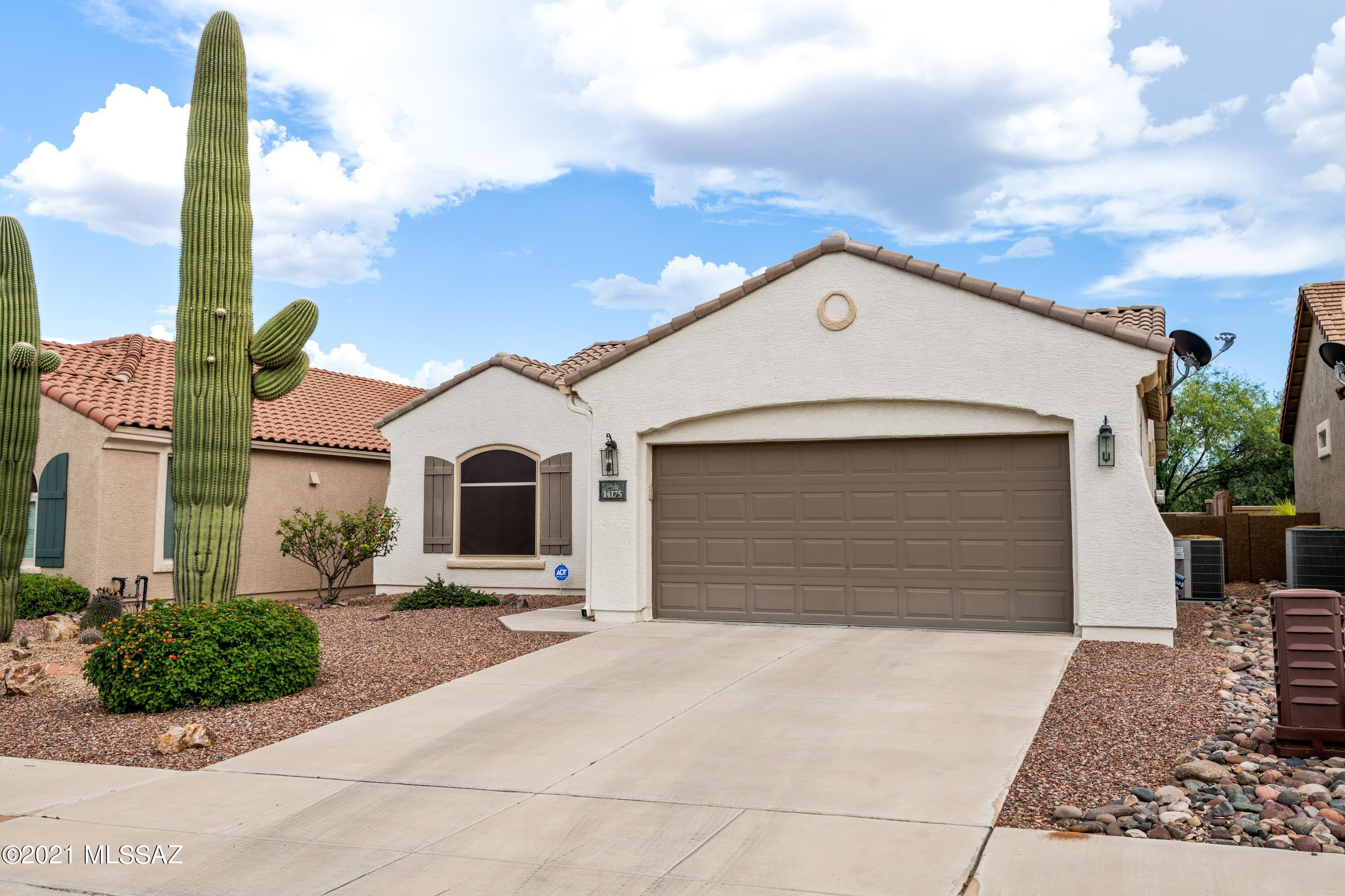 All the benefits of Sonora at Rancho Sahuarita; a beautiful move in ready home, a wonderful Del Webb active adult community, and access to all that Rancho Sahuarita recreation offers. Trails and recreation at every turn. Bright and inviting; it has new carpet, garbage disposal, and all know repairs already completed. Move in ready!  Enjoy the covered patio, backed up to natural desert, not your neighbors back yard. Have your favorite drink garnished with fresh Meyer lemons from your tree. Solar shades help keep the heat down.
