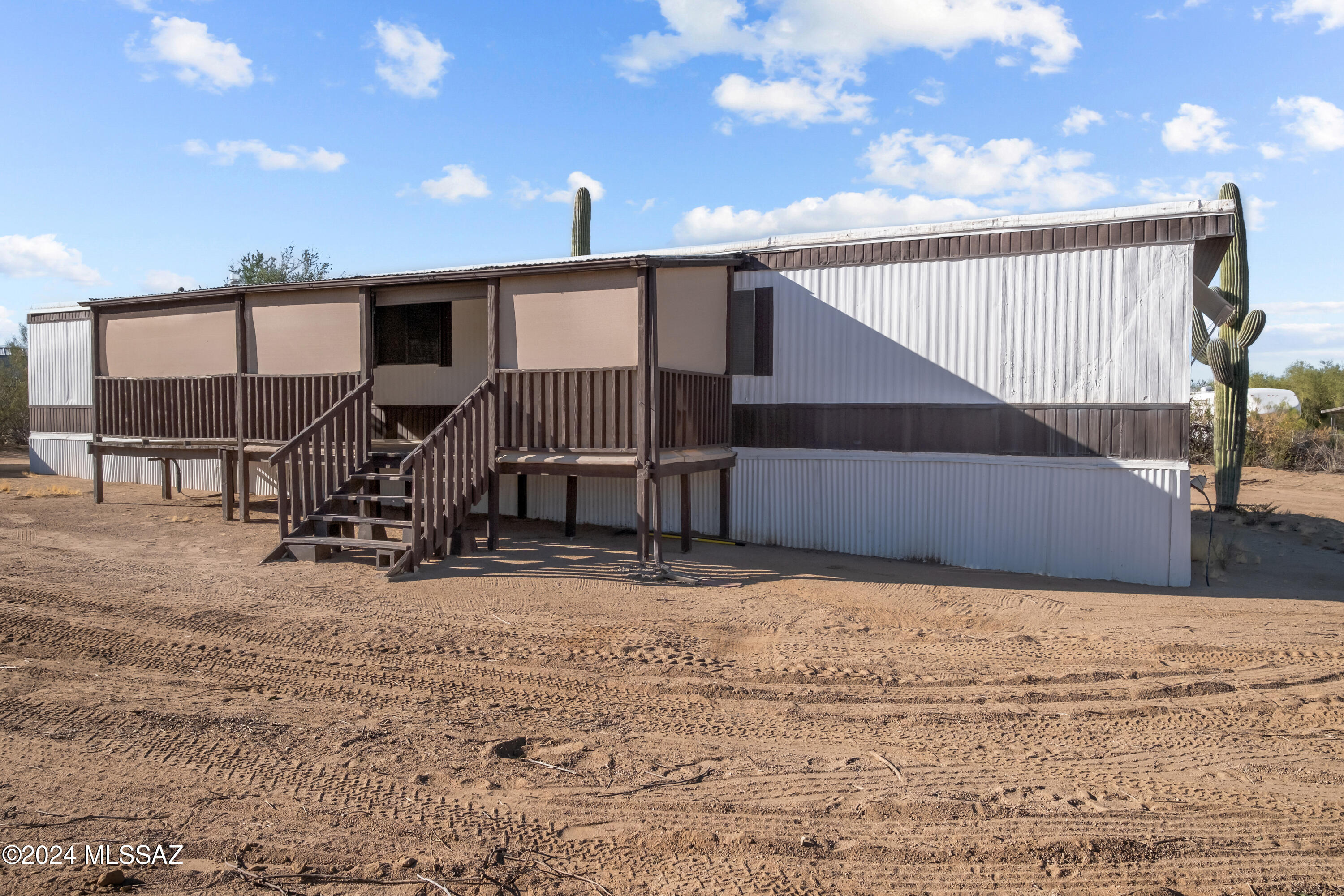 Escape to this charming 3-bedroom, 2-bathroom home on 1 acre in Picture Rocks. With no HOA, this completely fenced property offers endless possibilities for outdoor enthusiasts and those seeking a peaceful retreat. Whether you have pets, RVs, or a passion for hobbies, there's ample space to accommodate all your needs. Multiple sheds provide generous storage, keeping your property tidy and organized. You can enjoy the reassurance of recent upgrades, including a new water heater and central AC unit installed in 2018. Located just minutes from the breathtaking Saguaro National Park, this property boasts stunning views that will leave you in awe. Make this home yours! Being sold 'as is'