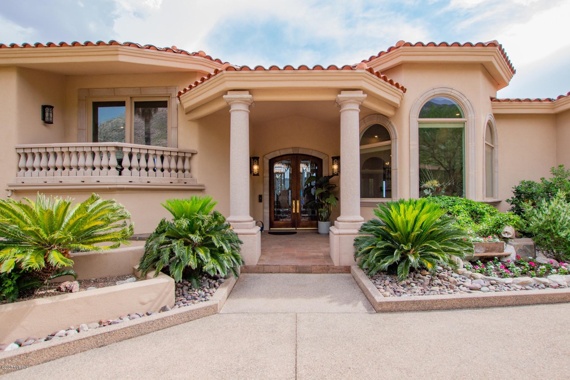 Exquisite Estate situated on an acre of land w/360 degree breathtaking Mountain & City Views.  Architecturally & aesthetically pleasing w/soaring ceilings, crown moulding, 2 fireplaces, welcoming palette, ceiling fans, plantation shutters/window blinds, & tiled floors. Wet bar in family room. Kitchen features granite counters, center island, high-end appliances, & European style cabinetry. Formal dining w/coffered ceiling.   2 Master bedrooms with massive custom closets, hardwood floors, & one w/a romantic fireplace! Vaulted wood beamed ceiling is stunning! The workout room is next to the master & balcony access to enjoy your morning coffee. Custom entertainment unit in bonus room.  Possible man cave w/bath, office space with built-in massive bookcases & several desks... Interior hot tub, wine cellar, & 5 upscale baths. The lower level offers 3 large bedrooms and 2 bathrooms. Sparkling infinity pool, spa, built-in kitchenette w/built-in BBQ, pavered covered patio, & endless views. This home is an entertainer's dream.  See it! Love It!