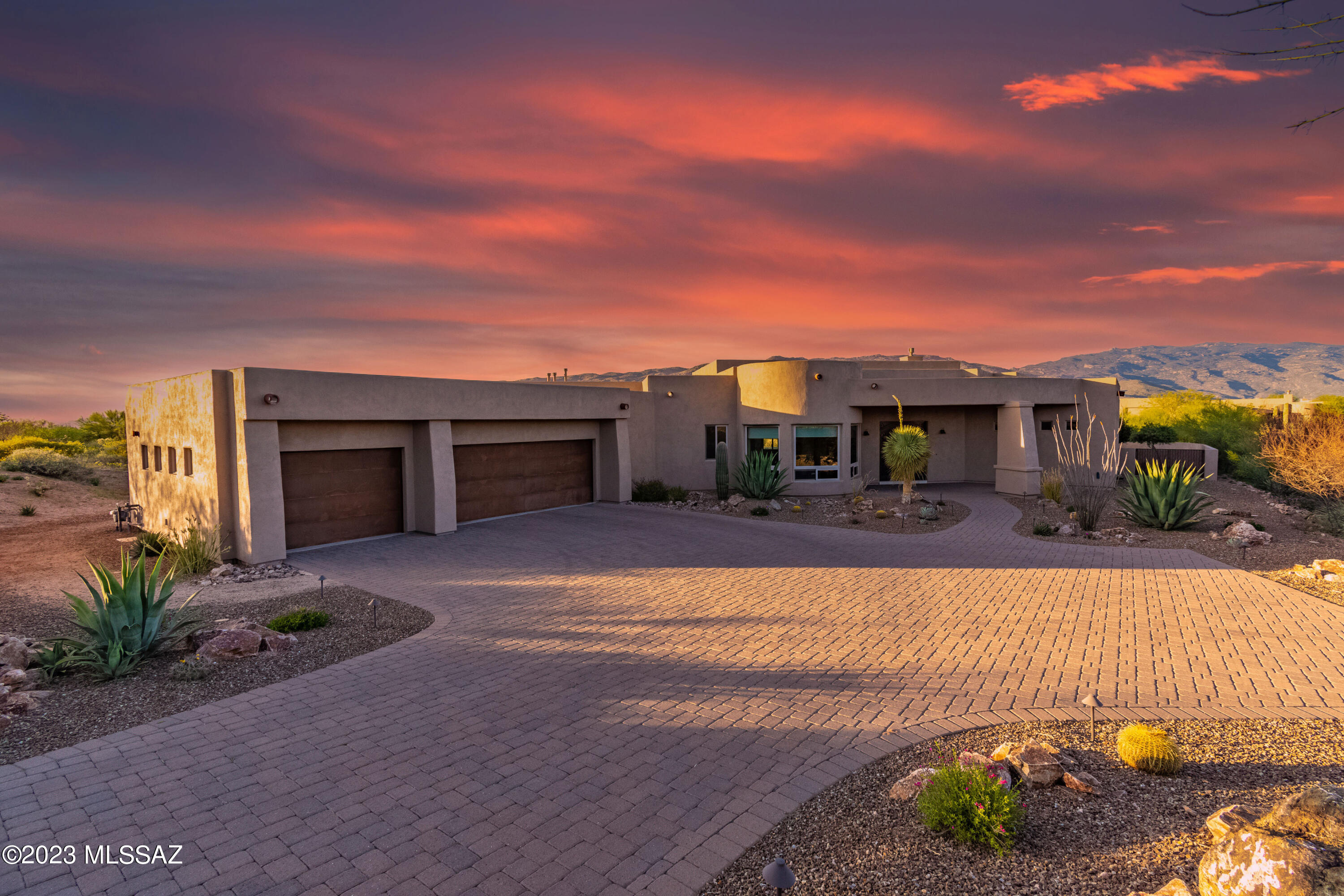 Welcome to this stunning luxury custom estate situated on a spacious 1.12-acre lot with a single-story design that offers breathtaking views. The interior of this magnificent home features exquisite details and luxurious finishes throughout. The spacious living room boasts soaring ceilings, an elegant fireplace & expansive windows that provide an abundance of natural light. The adjacent gourmet kitchen is a chef's dream with high-end appliances, custom cabinetry & a large seating bar perfect for entertaining guests. The home's master suite is a true sanctuary with a spa-like bathroom, snail travertine shower, dual vanities, and a massive walk-in closet. Three additional bedrooms that offer ample space for family or guests. Arrange your private showing appointment now! Step outside to the beautifully landscaped backyard, which is perfect for outdoor living & entertaining. The expansive 1100+ sqft covered patio provides ample space for al fresco dining, while the view fencing is perfect for enjoying the Southern Arizona sunshine and mild evenings. This luxury custom estate truly has
it all, from the stunning architecture and luxurious finishes to the incredible outdoor living spaces and prime location.
Extended 3-car garage with side storage area totals 1127 sqft for all your vehicles plus storage and toys.
Gated community in Vail School District offers plenty of amenities such as a recreation center, horse facilities and vast walking trails. Do not miss this opportunity to live in the lap of luxury in one of the most coveted neighborhoods.