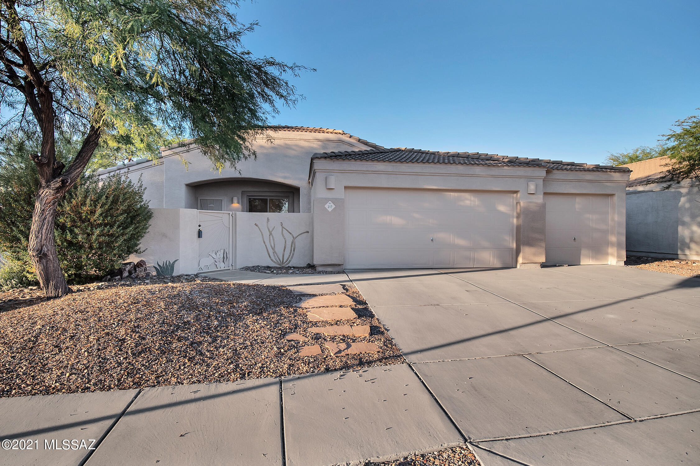 In the heart of Oro Valley in the premier community of Monterra Ridge! NEW CARPET NEW PAINT! Relax by the sparkling pebble-tec pool & built-in outdoor Kiva fireplace w/ cozy banco seating! 3 bed, 2 baths plus a co bonus/flex room off of the garage; , workout/yoga/craft room or man cave! Kitchen is beautifully appointed with GRANITE counters, subway tile backsplash, Stainless Steel appliances & espresso raised panel cabinetry.  Enjoy the private, secluded & gated courtyard space as additional yard & entertaining area with a great view of the Catalina Mountains! Bonus features: Tile floors & shower surround, dual vanity sinks, double decorative security screen, shutters, upper cabs in laundry, Attractive Southwestern door w/ speakeasy type peep window, BBQ gas stub.