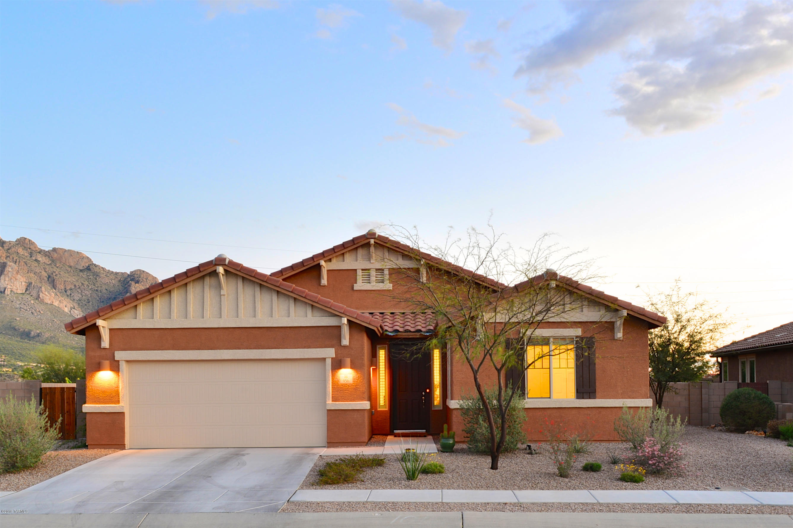 This like-new 3 BD/2.5 BA home has been lightly lived in and is move-in ready. Enjoy mountain views from your great room, gourmet kitchen, dining area and master bedroom. Light and bright, this split bedroom plan starts with a grand entry. The upgraded gourmet kitchen boasts stainless appliances and walk-in pantry. The master has dual sinks, walk-in shower, separate tub and walk-in closet. Other upgrades include flooring, additional master window, baths, wiring, and side yard wall extensions. The backyard is clean, ready for your own design and is large enough for a pool. Conveniently located near shopping, dining, parks, and schools. Call to see this home today!