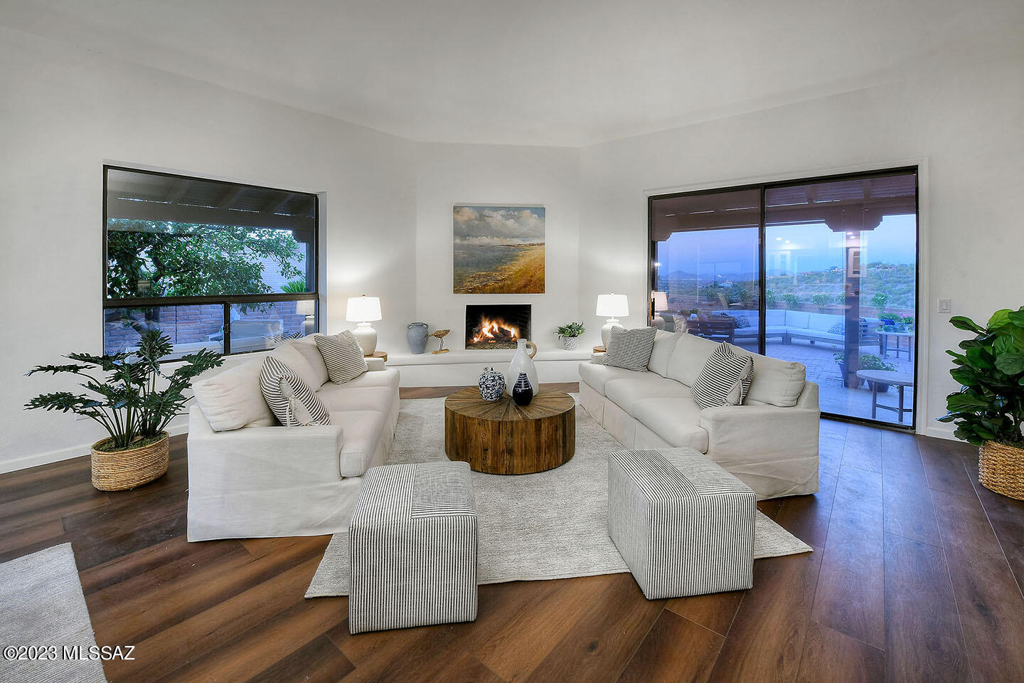 Views?  Downtown, The Catalina Mtns,.Amazing. I think of this home as Tucson meets Santa Barbara.  Visualize.. walls of windows with light at every turn, high ceilings, amazing kitchen with custom cabinets, and walls of whisper white w/ custom tile accents of muted blues.  Inside/ outside living with wrap around patios that you can't help but just sit and stay indefininetly. Personally.my favorite patio is elevated just perfectly to watch the sun set over Tucson. I have heard that this home is one of the truly ''special'' ones.  Not ostentatious, and yet eminates a classy inviting ambiance. I want to live here.