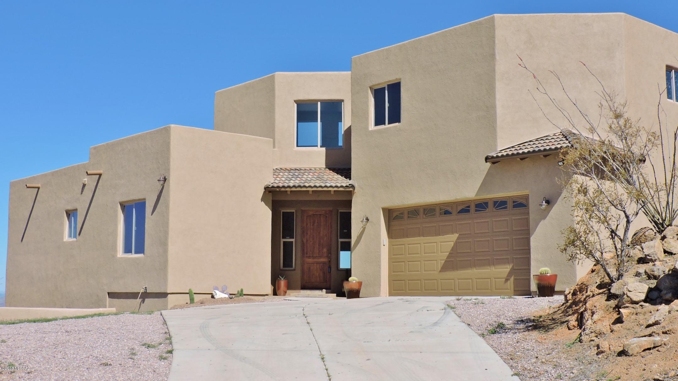 Spectacular Santa Fe Home with unbelievable views! Home has just been painted on both interior & exterior, has new granite counter tops in kitchen, upgraded cabinets & GE Profile appliances including refrigerator. New roof includes tile & flat area. New exterior tile on both balconies.  Laundry room has sink & extra cabinets. It is artistically designed & sited to capture all mountains views including San Cayetano from the extensive covered patio & interior. Great room features tongue in groove ceilings & beehive fireplace. Over-sized, upstairs private Master Bedroom suite with large walk-in closet, jetted tub, walk-in shower, dual sink vanities. Private balcony to enjoy the views. The two lower bedrooms are spacious & private. Over-sized garage has room for workshop & large vehicle. New  carpet in both master bedroom and adjacent loft which could be used for an office or setting area.