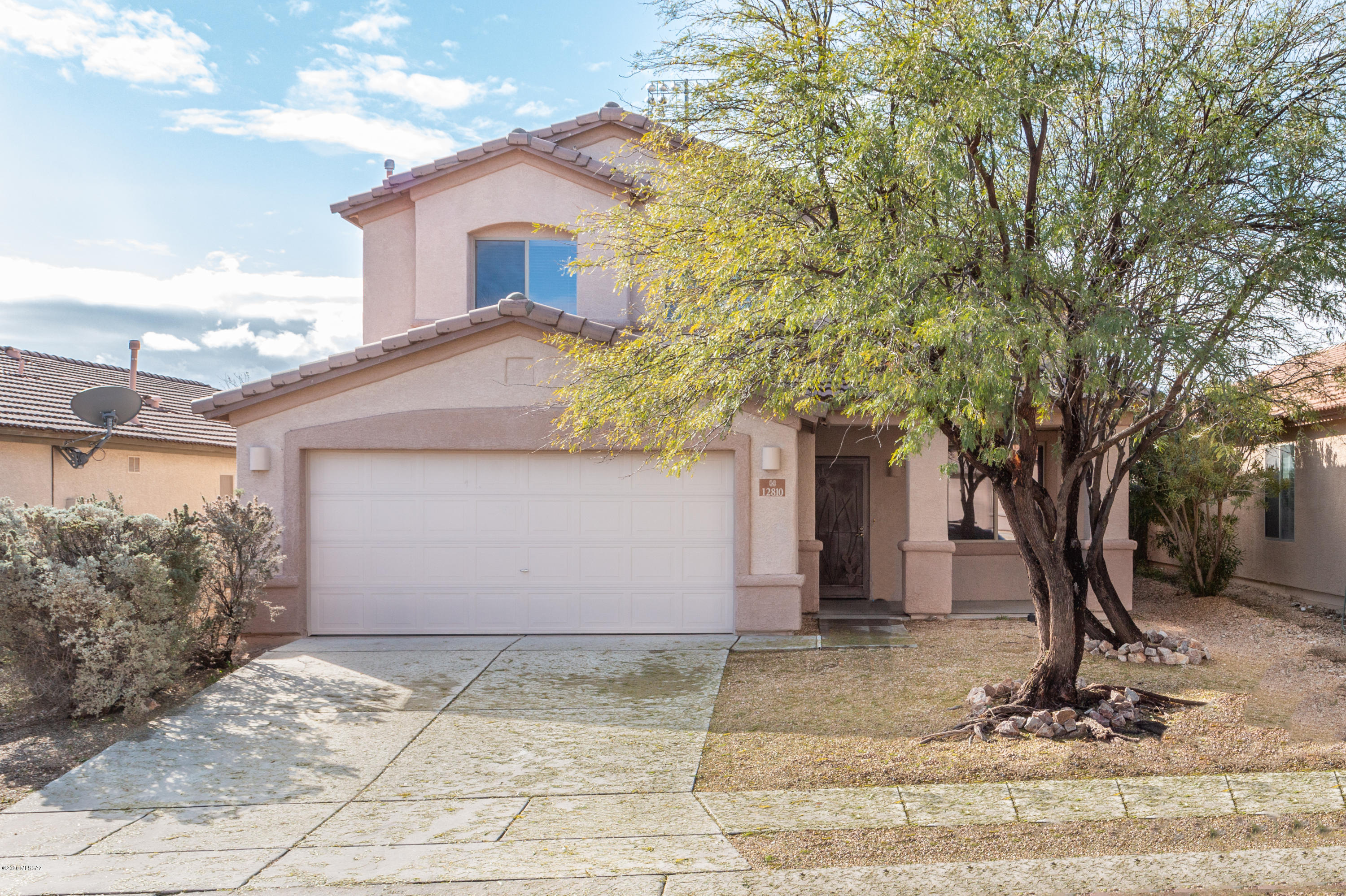 Located in the award-winning Vail School District. Greeted by a cozy covered front patio, then enter the home to ''wow-worthy'' soaring ceilings in the formal dining/family room that's overlooked by the beautiful wrought iron railing leading to the second story. Upstairs has a small loft area with 3 ample sized BR. The master suite offers a separate garden tub & shower, as well as a large walk-in closet. Recently painted & new carpet throughout, all neutral colors offers a light and bright feel. Main level has an office/den that can easily be converted to a 4th BR. Kitchen has a delightful Island/breakfast bar overlooking the great room, a large pantry, updated backsplash, granite counters & sleek SS appliances including a gas range. The back covered patio is a great spot to relax and unwind with a low-care back yard with new gravel. Schedule your showing today.