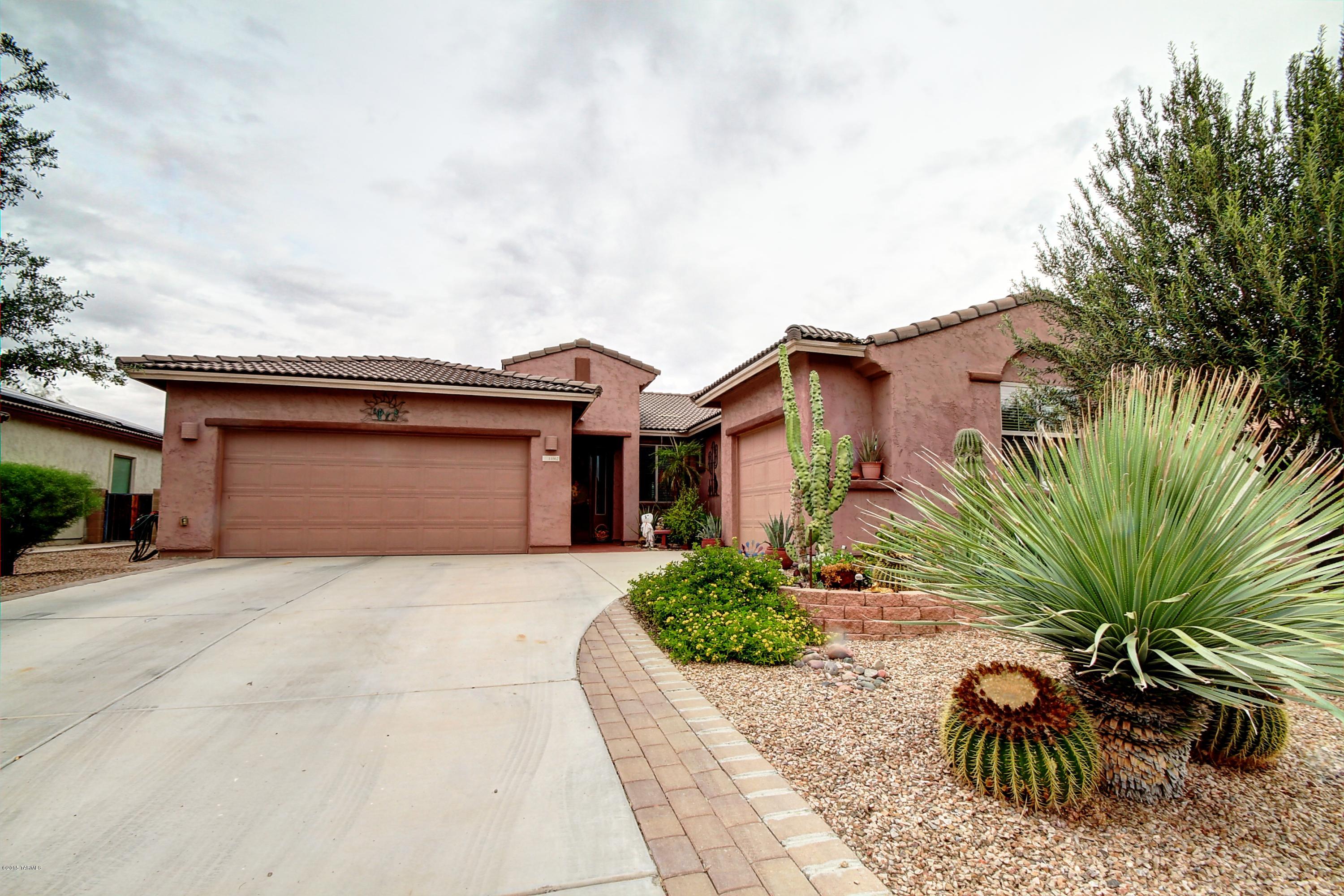 Beautiful 3BD/2BA contemporary home in Gladden Farms. Dramatic foyer entry, custom niches, diagonal 20' tile throughout.  Spacious kitchen features cherry cabinets with pull outs, stainless appliances, gas line at range and walk in pantry.  Separate Breakfast area, formal dining room and Den. Master bath features dual sinks, separate shower & tub. 3 car garage, double garage has AC. Enclosed backyard, with pavers, artificial grass, barbecue, covered patio and storage with tile roof and even has a separate double gate on side of house for trailer storage. Convenient to I-10 & shopping and walking distance to new school.