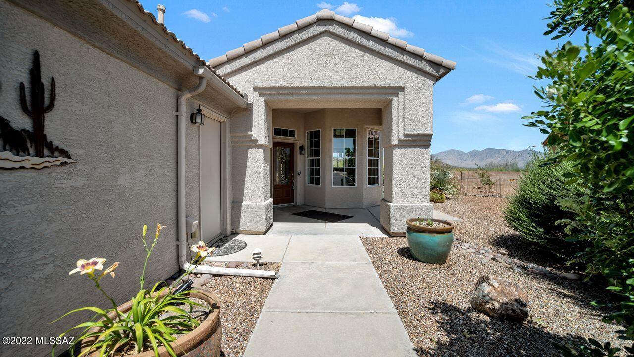 STUNNING Tortolita & Catalina Mountain views from the back patio of this home in The Highlands at Dove Mountain. Foyer opens to large living/dining space with views to the mountains.  Roomy kitchen with nook & breakfast bar, pantry closet, cabinet pullouts, R/O system.  Roomy primary suite with patio access, large walk in closet, dual sinks, spacious shower with two benches.  Second bedroom features large sliding door closet.  Hall bath with tub/shower combo.  Large laundry room with access to 2 car garage.  Covered & open patio areas, raised planting beds boasting lilies, fruit tree & other colorful plants. Freshly painted interior plus all new, neutral carpet!
