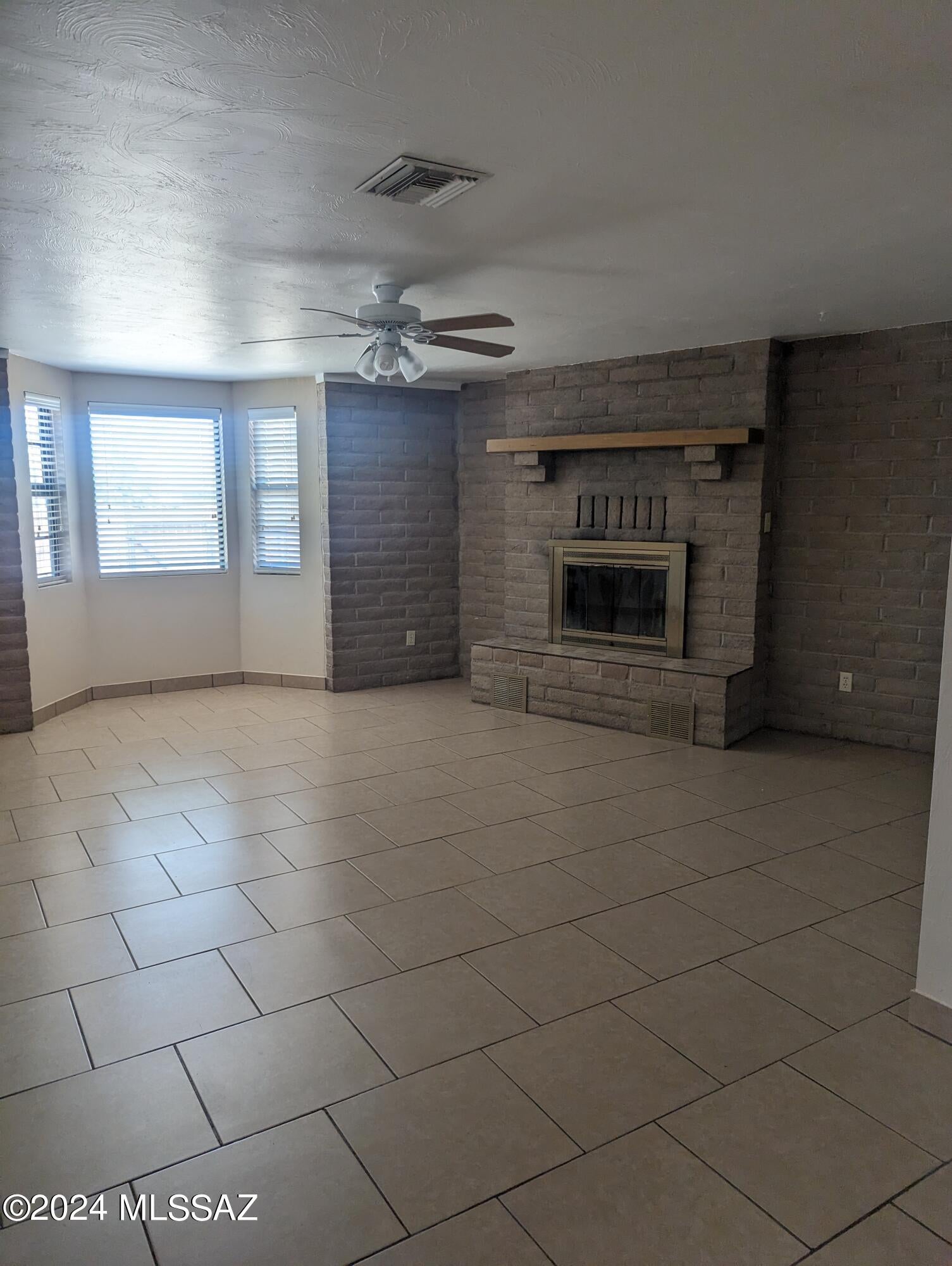 MOVE IN READY-3 bedroom, 2 bath corner lot on the Southeast side.  Living and dining room plus family room with fireplace, kitchen with all appliances and pantry, laundry room with hook ups and extra storage.  Master bedroom has 2 closets and private door to backyard.  Master bath has large tub(jacuzzi part does not work).  Backyard with covered patio and trees for shade.  Fresh paint and updated hall bath, tile in heavy traffic areas with new carpet in the bedrooms.  Pet rent is $25.00 per month, plus $5.00 for each additional pet.  Small dogs allowed, but sorry NO CATS ALLOWED.  Pets must be approved by submitting pictures to listing agent.