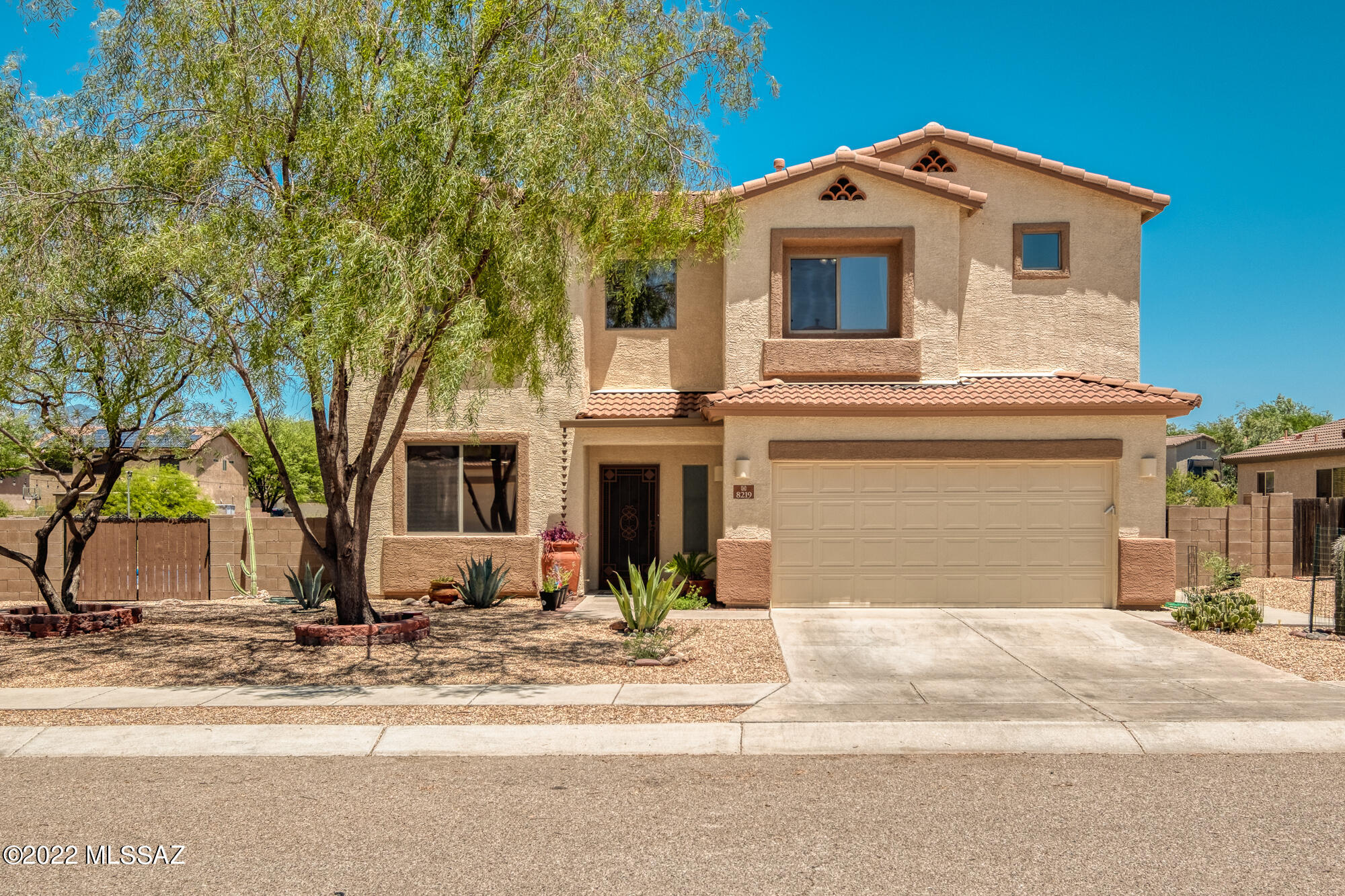 Welcome to this 4 bed, 3.5 bath home w/ sparkling pool & breathtaking Rincon Mountain Range views located on corner lot & backs up to wash.  As you enter the home you are greeted to a large family room off the kitchen w/ desk, eat-in kitchen, SS appliances, & granite countertops. An office/dining room space, 1/2 bath & entrance to 3 car tandem garage finishes off the 1st floor.  The primary bedroom suite with dual vanities, garden tub, separate shower, & large closet is a great place to relax after a long day.  3 more bedrooms, 2 more bathrooms, a large loft & laundry room finish off the 2nd floor.  Backyard features a pebbletech pool w/pent-air pool equipment, salt/chlorine generator & UV filter.  A full length covered patio and artificial grass make the backyard great for hosting.