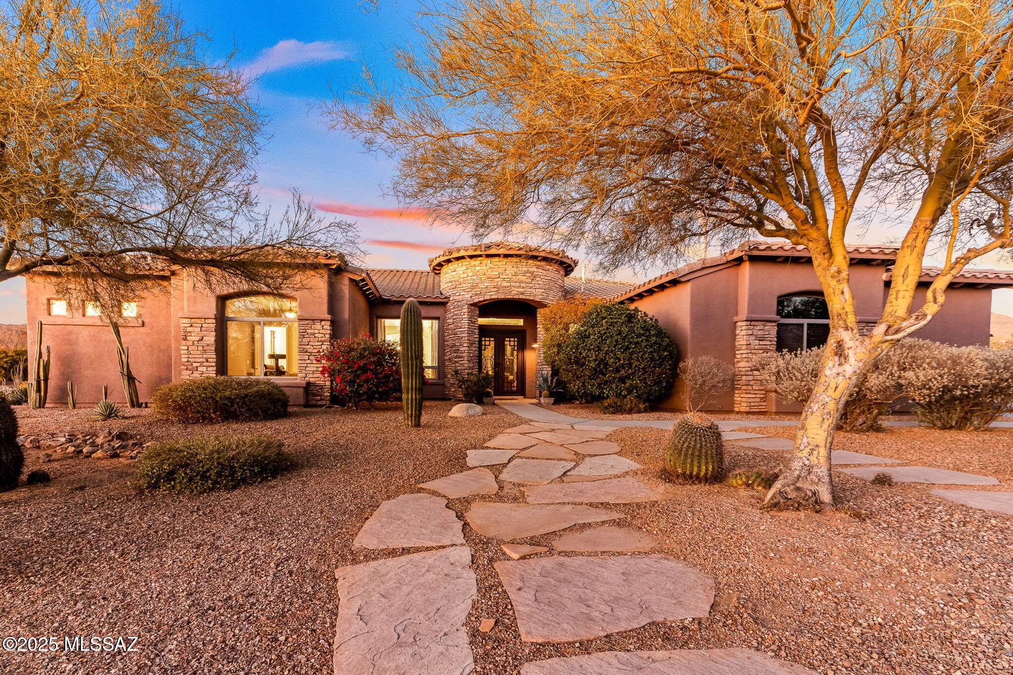 BEST DEAL IN DOVE MOUNTAIN!!! Beautifully Remodeled Home with Stunning Mountain Views in Dos Lagos at Dove Mountain. Welcome to this gorgeous 3-bedroom, 4-bathroom home in the gated community of Dos Lagos at Dove Mountain. Thoughtfully remodeled with modern touches and timeless elegance, this home offers the perfect blend of style, comfort, and privacy. Step inside and immediately feel at home with new engineered wood flooring and a beautifully updated kitchen featuring sleek cabinetry and plenty of space to cook and entertain. The great room and living room have been redesigned with custom shelving, adding warmth and character to the space. A dedicated office space features new custom cabinets and shelving, creating a stylish and functional workspace. The primary suite is a true retreat complete with his and hers walk-in closets and a spa-like bathroom. Outside, your own private oasis awaits. Take in the breathtaking mountain views while relaxing in the pool and spa, the perfect spot for unwinding or entertaining guests. This home is all about comfort, beauty, and tranquility!