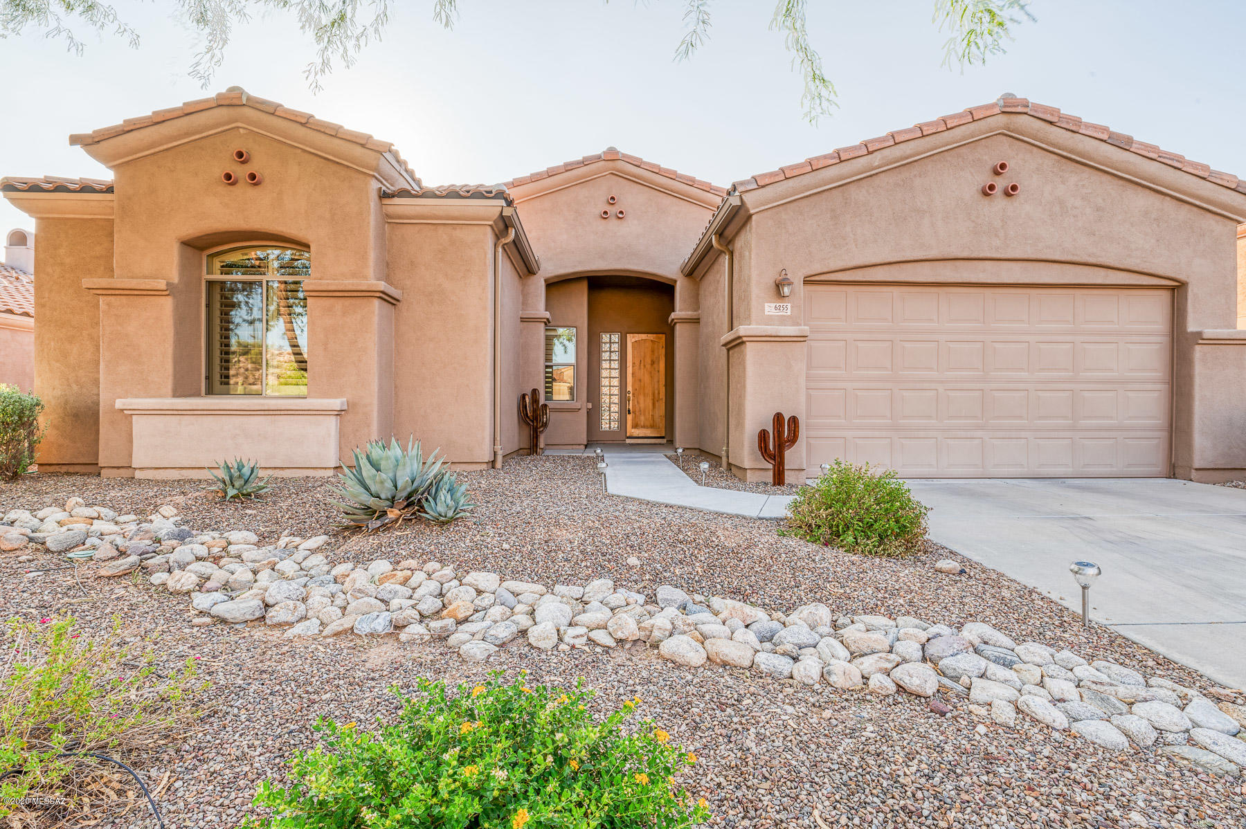 Pride of ownership is evident in this turn key home located within the gated neighborhood of La Paloma. Fantastic great room layout provides room to spread out & entertain. Kitchen is open concept with beautiful high end leathered granite, stainless steel appliances, & gas stove top. Grand Master Suite with dual walk in closets, large bathroom with dual vanities, soaking tub and walk in shower. Second Bedroom has en-suite bathroom and walk in closet. Additional Large Den/office offers a perfect work/hobby area. Laundry room with utility sink and built in cabinetry allows plenty of storage. Newer HVAC, newer water heater, completely landscaped property make this truly turn key. Most furniture can convey with property should new Buyer desire. Virtual Tour available.