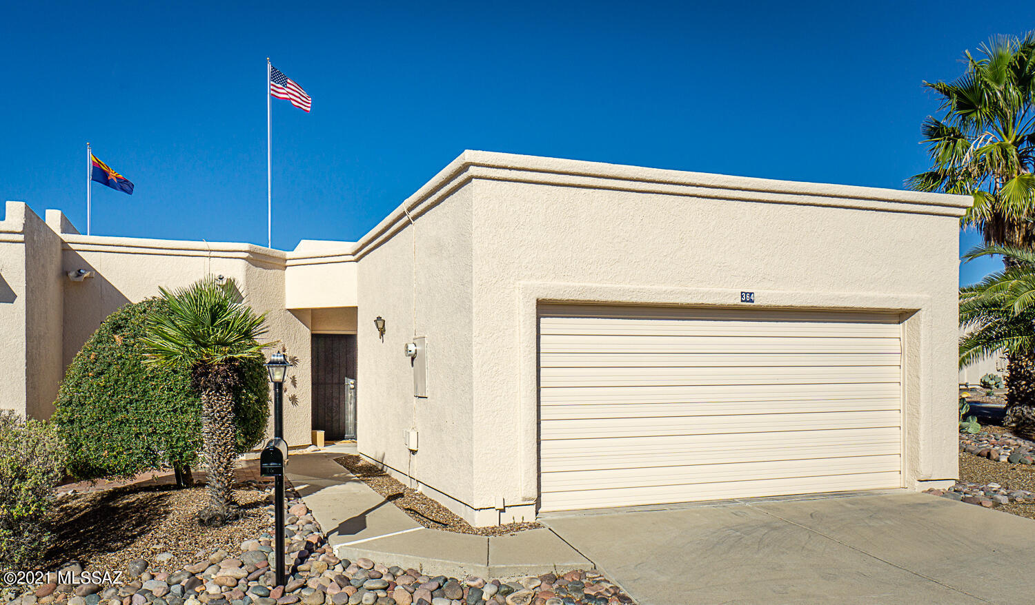 Spacious, light filled Green Valley Townhome with high ceiling, transom windows, plantation shutters throughout, and multiple skylights.  Arches add  elegance to the interior beauty of the home.  White kitchen cabinets and ceramic tile with kitchen eating area and large pantry. The Great Room features a wood burning fireplace and formal dining area   2 BR 2 Ba plus a large Den with skylight. Backyard covered patio wraps around back and side the home. Bryant HVAC installed  2014  Garage with storage cabinets, skylight and laundry area. The HOA paints the exterior of this home so that's worry free.  Outstanding location in Green Valley in walking distance to GVR pool, walking trails, and easy access to all shopping and restaurants