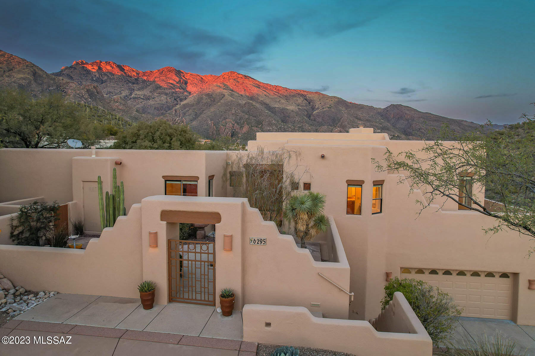 Majestic Catalina Mountain views frame this stunning one owner 4BR custom home in prestigious Alta Vista. The .48 acre elevated lot borders 118 +/- acres of natural desert (common area) and offers privacy and amazing views. Spacious great room has high beamed ceilings, floor to ceiling windows, cozy fireplace and incredible views! Island kitchen with SS appliances and beautiful wood cabinetry. Spacious primary suite. The luxurious bathroom has beautiful tile, dual vanities, large walk-in closet,  separate tub and shower. Enjoy the great outdoors in the north east facing rear yard with covered patio, fireplace and amazing views. Home was freshly painted inside & out. Roof serviced with 3 year warranty. Updated HVAC Units. Walk-out deck above oversized garage. See floor plan in documents. Stairs from main level of home lead down to oversized garage. Park at upper level colored concrete driveway and there are no stairs in main living areas of home.  

Updated HVAC units. One was installed in 2011 and the other was installed in 2018.

Please write in offer no SPDS. Call LA for info. Over $25,000 spent on recent improvements (include landscape cleanup). See  estimates in attached documents. 

There is a pocket door neat the guest bathroom that when closed makes a perfect guest quarters or guest suite as it has 2 bedrooms and one bathroom. There is also a wall hide a bed in one of the bedrooms. 

Please escrow with 
Desha K. Jackson Pioneer Title Agency
Branch Manager/Sr. Commercial Escrow Officer
1660 East River Road Suite 150
Tucson, Arizona 85718
Office: 520.529.0700 Ext. 824
Fax:  866.738.5940
desha.jackson@ptaaz.com
teamjackson@ptaaz.com