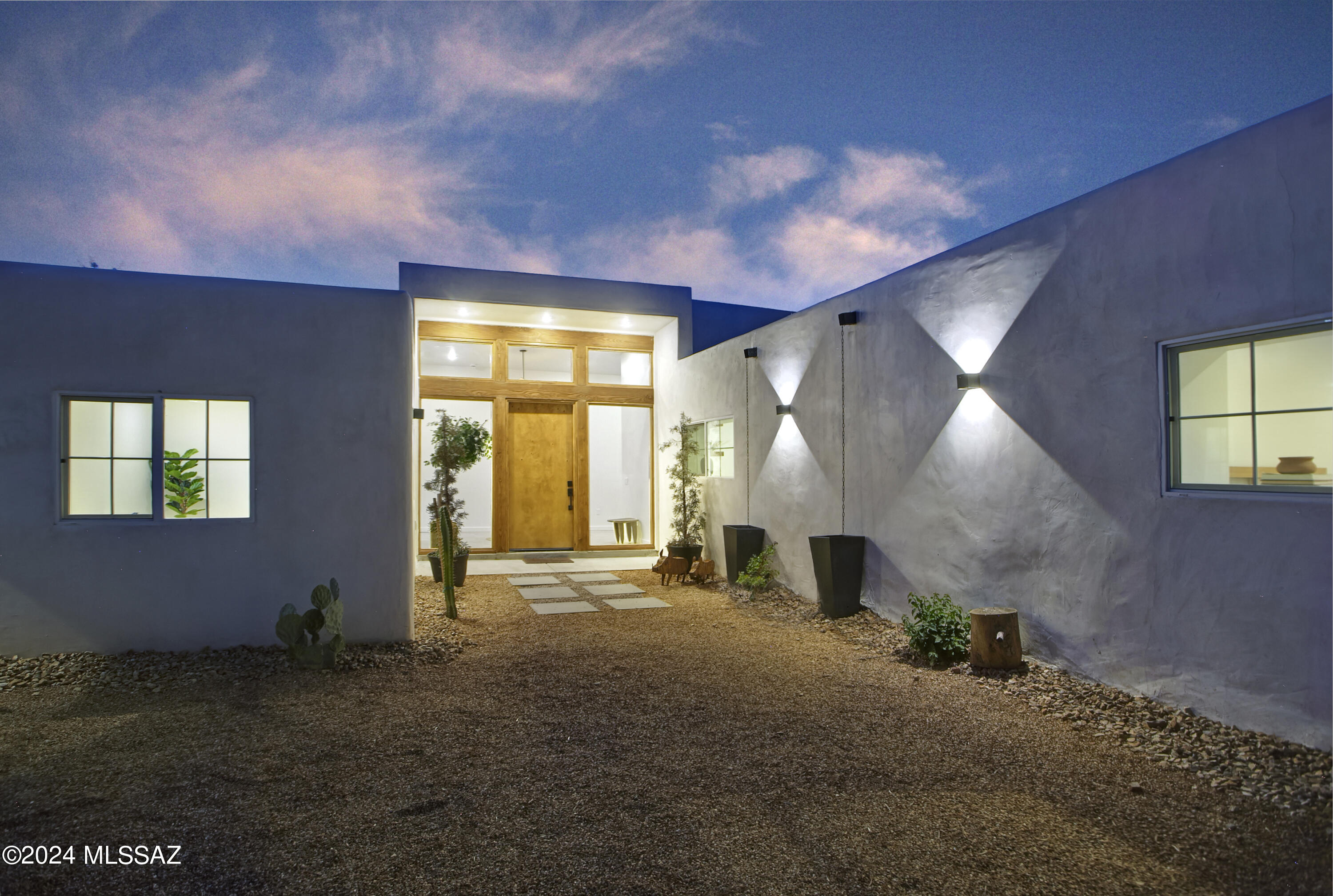 A creative expression blending historical elements, mid-century style and modern features creating a one-of-a-kind property in the heart of Tucson. The original 1947 mud adobe structure and combination of rural & urban provided inspiration for a dynamic architectural team to expand (nearly doubling the space) and reimagine this home. Carefully curated, the design honors the desert, while offering a fresh look & layout that suits today's lifestyle. Starting with the arrival through a beautiful casement entry door leading to a dramatic entry, everything here is custom and intentional. Form meets function with an open living space and split floor plan that provides 3 bedrooms, 2 ½ bathrooms and a pocket office, spanning 2278 sq ft. The materials and design elements are simple, yet elegant. Light filled spaces are dotted with custom millwork, solid wood beams, perfectly positioned skylights, and carefully placed windows that draw the eye to green outside. Made to live and last, you will find large format tile and engineered hardwood on the floors, quartz counters, and soft close cabinetry. Sustainability was also top of mind in maintaining the adobe & masonry walls, adding insulation, installing electric appliances and selecting a light exterior for reflective qualities.

There is an artistic and indigenous feeling in the historic neighborhood. Years ago, RillitoBend was home to the famous painters Maynard Dixion, Ted De Grazia and other creative spirits. Situated along the Rillito River, mature trees and community gardens are scattered throughout. Founded in 2010, 44 acres of open space with abundant plants and wildlife are available to enjoy at the Rio Vista Natural Resource Park.

Although this property feels tucked away, everything the city has to offer is at your fingertips. Immediate access to Bicycle Boulevard provides the opportunity to ride to work or amenities. Within a ½ mile, residents enjoy the Rio Vista Park, the Tucson Raquet Club & access to The Loop along the Rillito River, which makes a variety of shops, restaurants and farmer's markets available by way of bike or foot. Directly south, the Winterhaven festival of lights is walkable every holiday season, while the University of Arizona is less than 4 miles away.

This relaxed and community-oriented setting would make a wonderful full-time home or seasonal residence. With no HOA or deed restrictions, it would also be well positioned as a short-term rental.