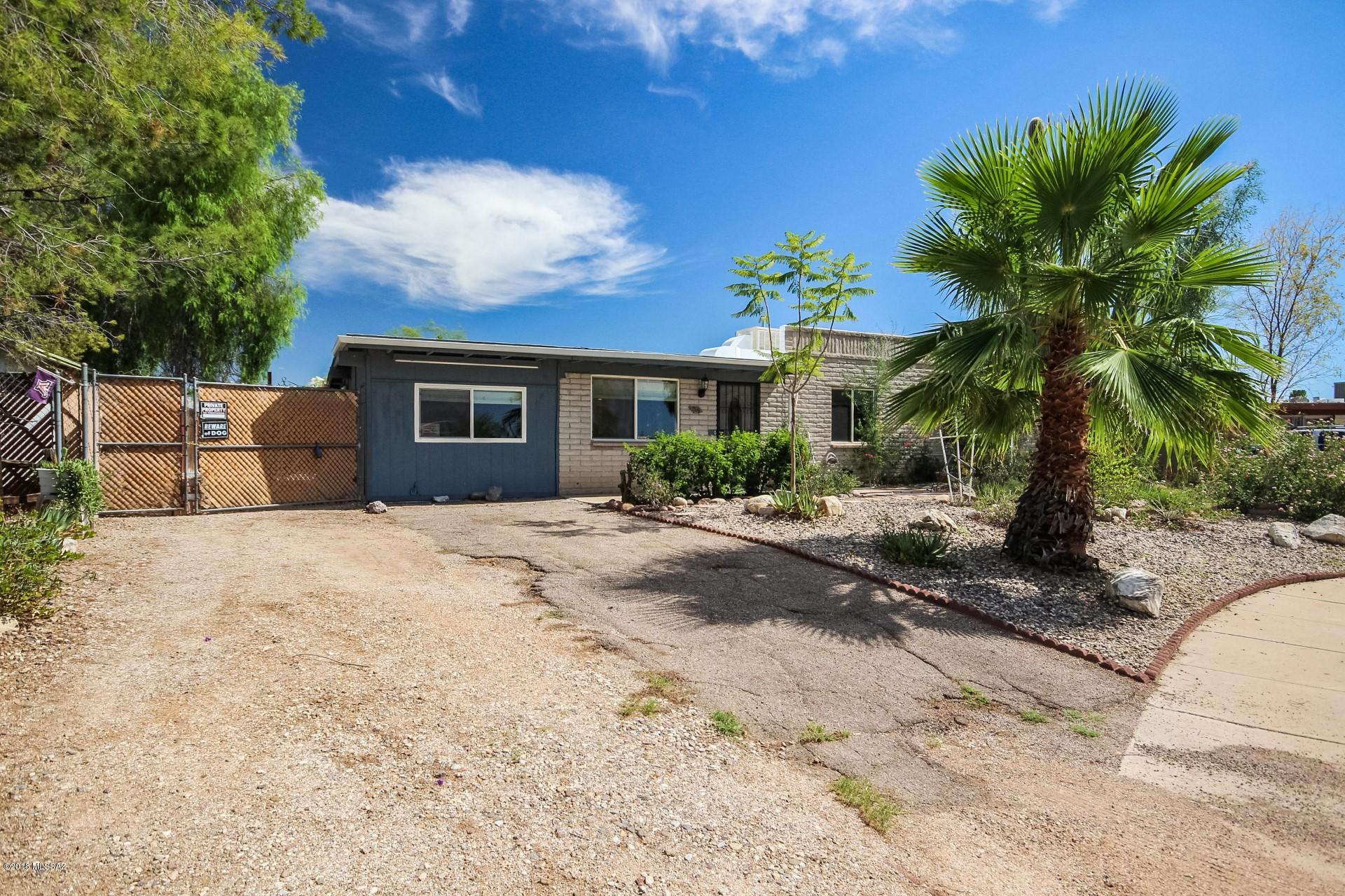SELLER WILL COUNTER OR ACCEPT OFFERS BETWEEN $150-155,000. Fantastic Tucson home with a refreshing blue pool, and low care landscape! Great opportunity to put your personal touches on this 3 bed home with custom paint tones, and picture windows that allow for tons of natural light. Functional kitchen features white appliances, and ample cabinet & counter space. Generous backyard has an extended covered patio that overlooks the pool, and landscape. This home is ready and waiting for you!