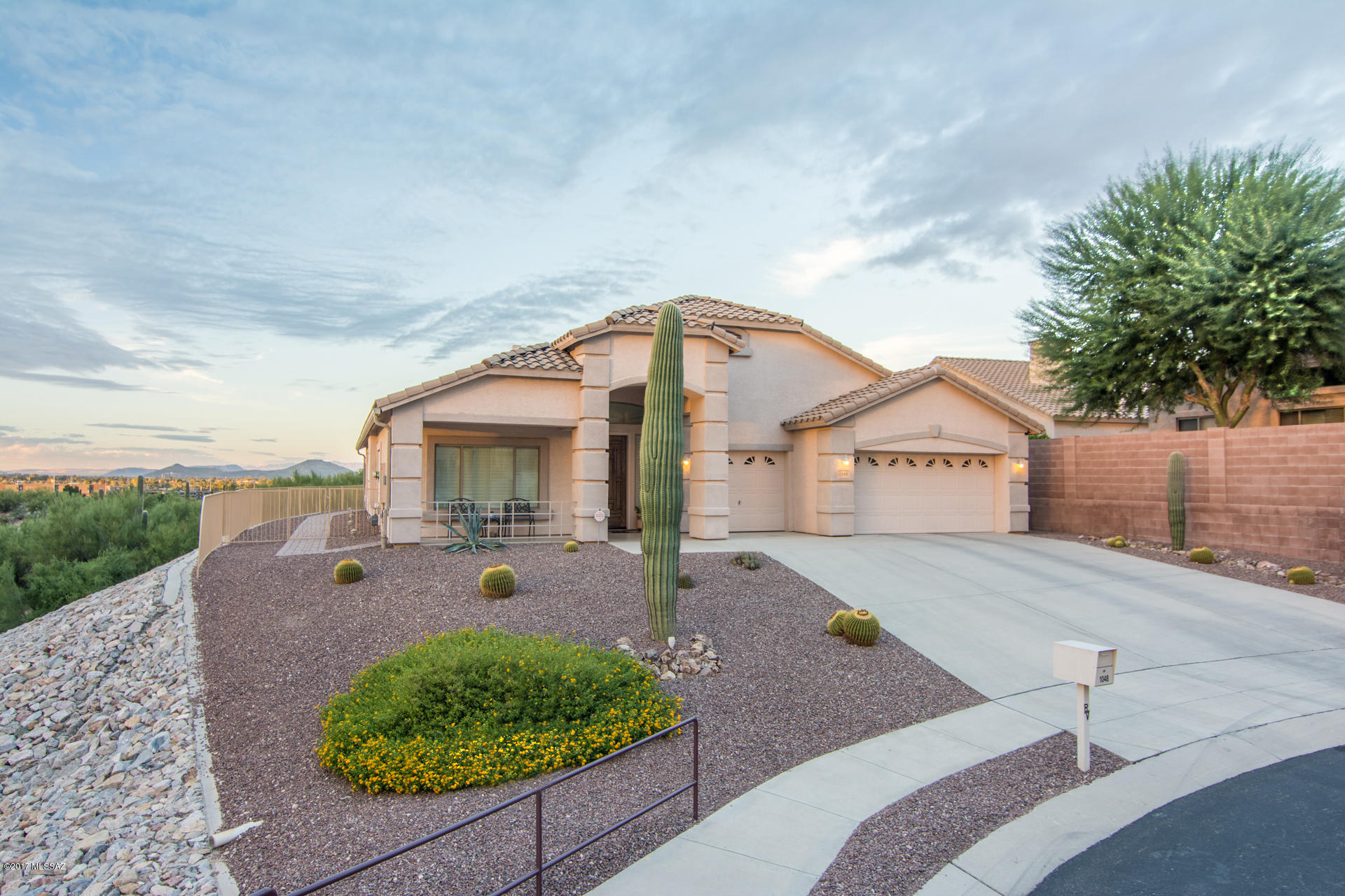 You'll love the privacy of the cul de sac lot as you enjoy the stunning mountain and city views from this gated River View Estates home.  Attention to detail throughout - upgraded kitchen (custom cabinetry and granite), extra large pantry, plantation shutters, Hunter Douglas shades, California Closet in master, extensive storage throughout, extended 3 car garage with storage cabinets and workbench, custom lighting and more. The den has custom built ins but could be a 4th bedroom.   Kitchen opens to the large family room with its own gas fireplace and views to the city.  It's just right!