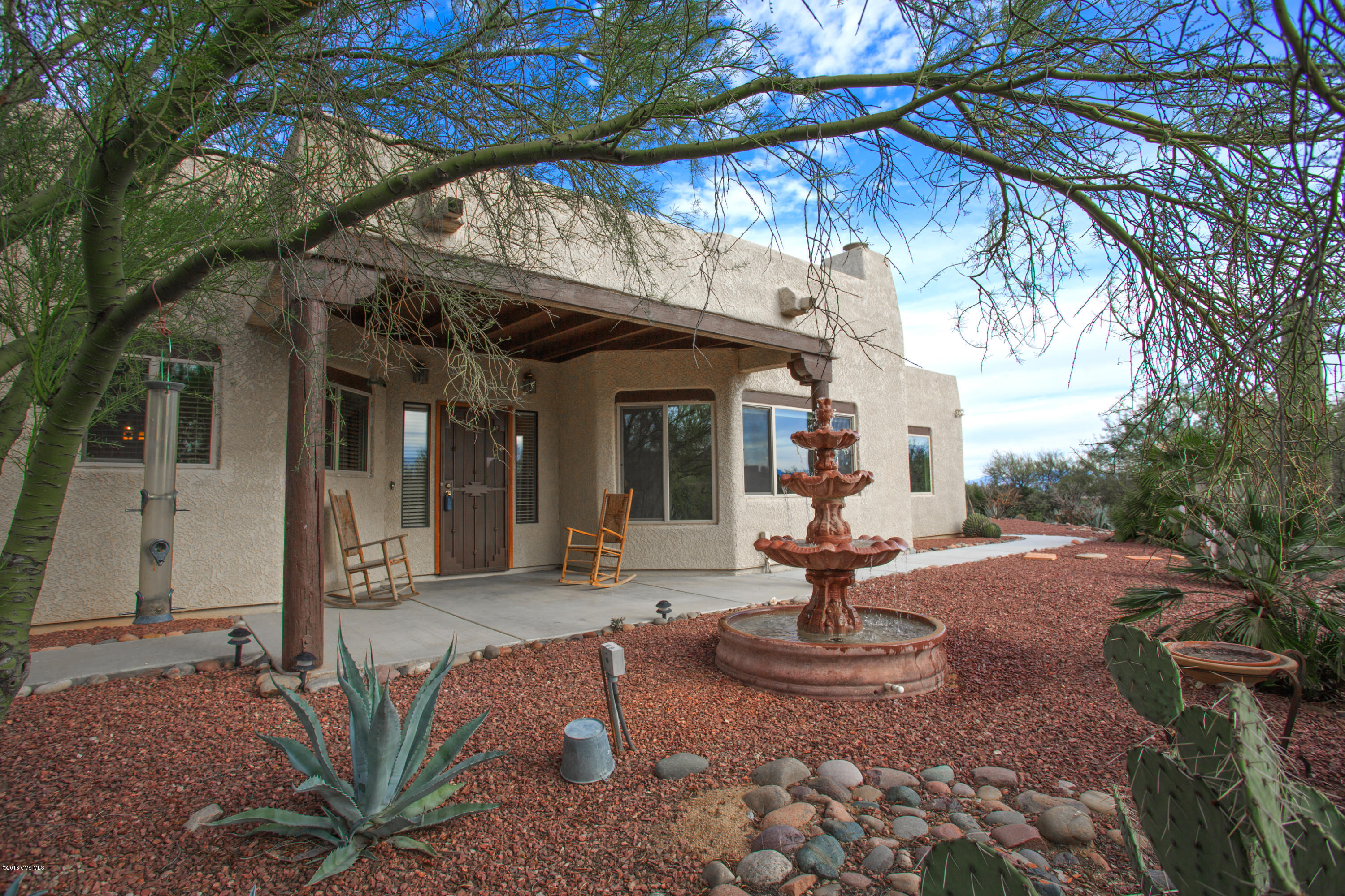Nestled in the lush desert an oasis awaits you. This Santa Fe style home with new wooden floors, windows and sliding doors, stainless steel kitchen appliances and so much more is sure to delight you (see docs for list). Enjoy the VIEWS while sitting in your pebble tec spa and the peaceful trickle of water into the solar heated pool. If you prefer to star gaze sit on your front porch and contemplate the mysteries of the Milky Way. Come enjoy the exclusive neighborhood of Rancho Buena Vista.