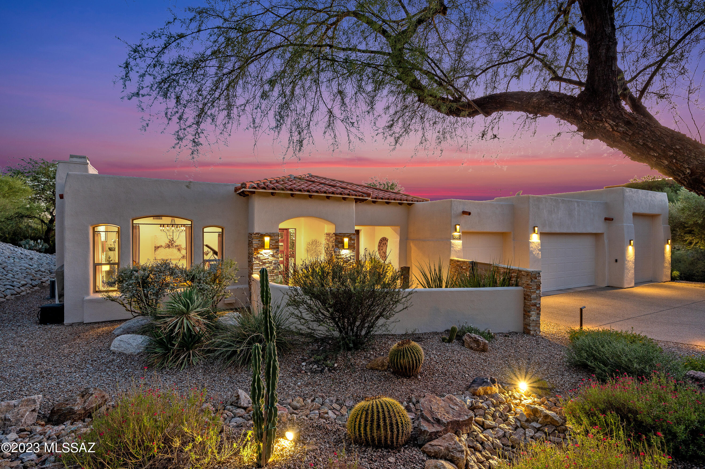 Tucked away in an enclave of Tucson's most desired area, a serene, immaculately maintained modern, masterpiece on 1+ acres. Open/split floor plan stunningly remodeled (custom cabinets, chef's kitchen, double ovens, high-end appliances & porcelain tile, seamlessly integrating outdoor oasis w/ lush, mature landscaping. Entry courtyard illuminates custom water feature & Mexican river rock. Great room transitions to backyard resort including several enjoyment areas w/ fire pit, pool, pond, built-in grill, entertainment areas & fireplace. Meticulously execution w/ no expense spared including expansive owner's suite (jacuzzi tub &  walk-in shower). 4-car garage includes one RV bay and one bay w/HVAC, & cabinetry. Catalina Foothills Dist.16, no HOA. All your modern-desert dreams will come alive.