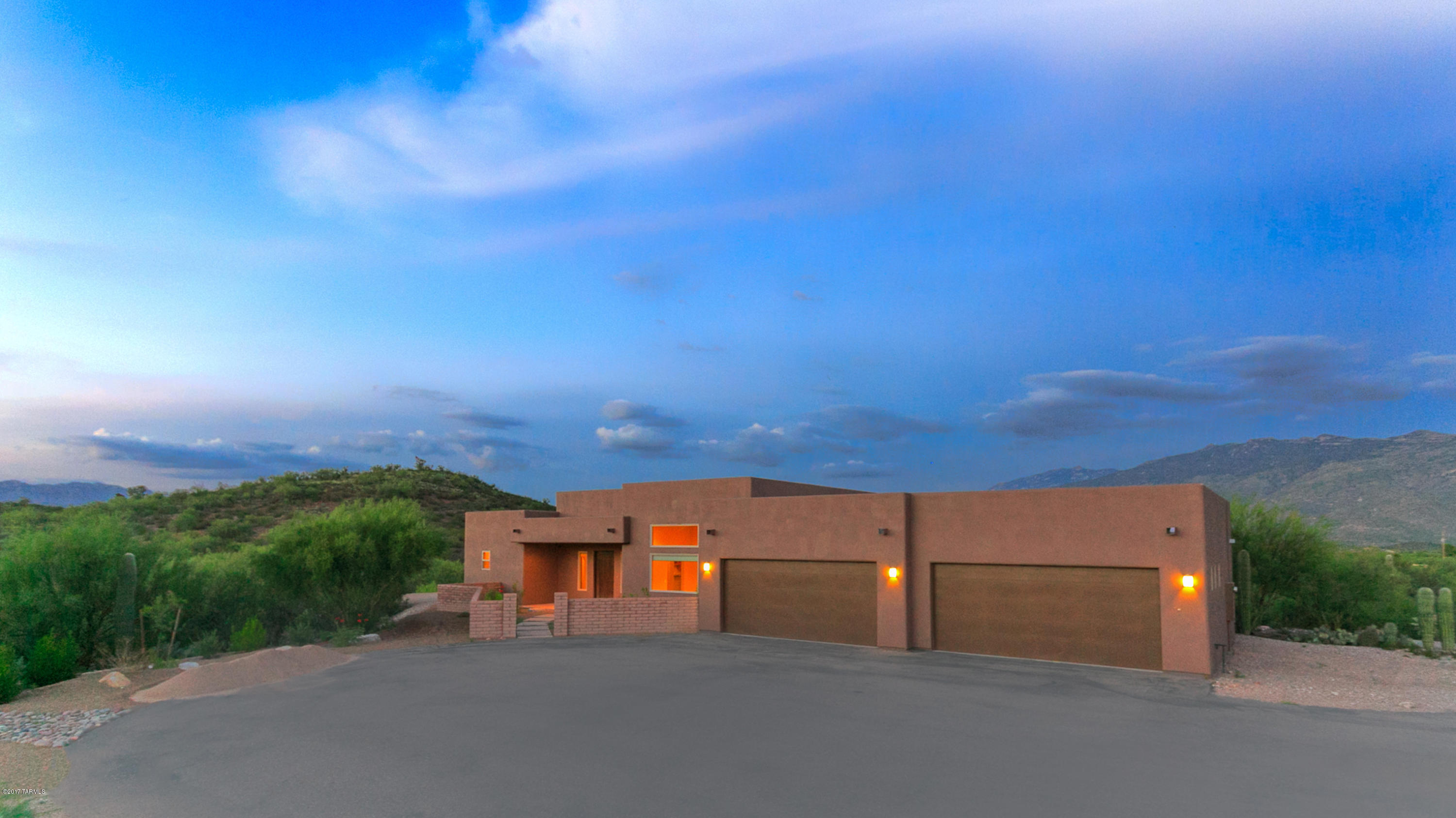 Stunning Custom Contemporary Home with Clean Lines, High Ceilings & an Open Great Room Design in an Extremely Private, Peaceful 3.48 Acre Setting Featuring Sweeping Catalina & Rincon Mountain Views. Dream Chef's Kitchen with Slab Granite Counters, Maple Cabinets with Soft-Close Drawers, Huge Center Island, Stainless Appliances, Double Refrigerators & Ovens, Beverage Refrigerator, Induction Cooktop, Warming Drawer & Breakfast Bar. Great Room with Inviting Fireplace & Wet Bar. Living & Dining Rooms for Entertaining. Spacious Master Suite with Sitting Room & Walk-in Closet. Elegant Master Bath with Spa Tub, Granite Counters & Double Sink Vanity. Huge Laundry Room with Cabinets. Built-in Speakers. Oversized 4-Car Garage. Tanque Verde School District. Exquisite Detail & Quality. Move-in Ready.