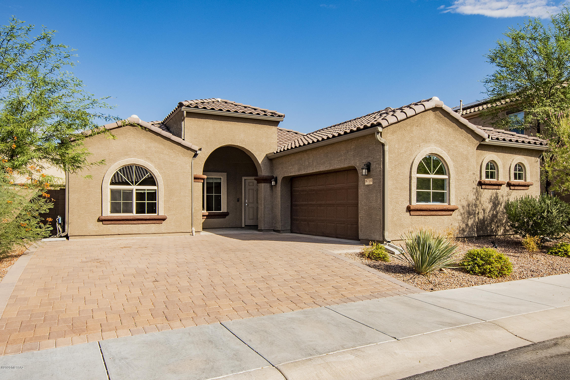 This exquisite one story 4 bedroom Kramden model in highly desirable Saguaro Bloom community has been upgraded with ceramic wood-look tile throughout. The wide-open floor plan and soaring ceilings give this home an open, airy feel. Shows like a new home with fresh paint and upgrades galore, alarm system, water softener, r/o unit in the kitchen, and even a Ring doorbell and Honeywell Smart Home Thermostat. The back yard features artificial grass to minimize your water bills and eliminate the upkeep. It's impossible to find a single story 4 bedroom home with den/office/bonus room in such pristine condition anywhere else in the NW at this modest price.
