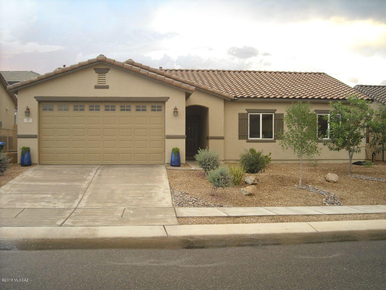 Beautiful well laid home with many delightful features! Large open kitchen with center island. Den creates more space for anything you want. Gorgeous flooring and other great features make this home move-in ready for you to add your own special touches! Ceiling fans throughout, and a gorgeous yard with mature trees and grass! Don't miss the great amenities of Rancho Sahuarita as well!