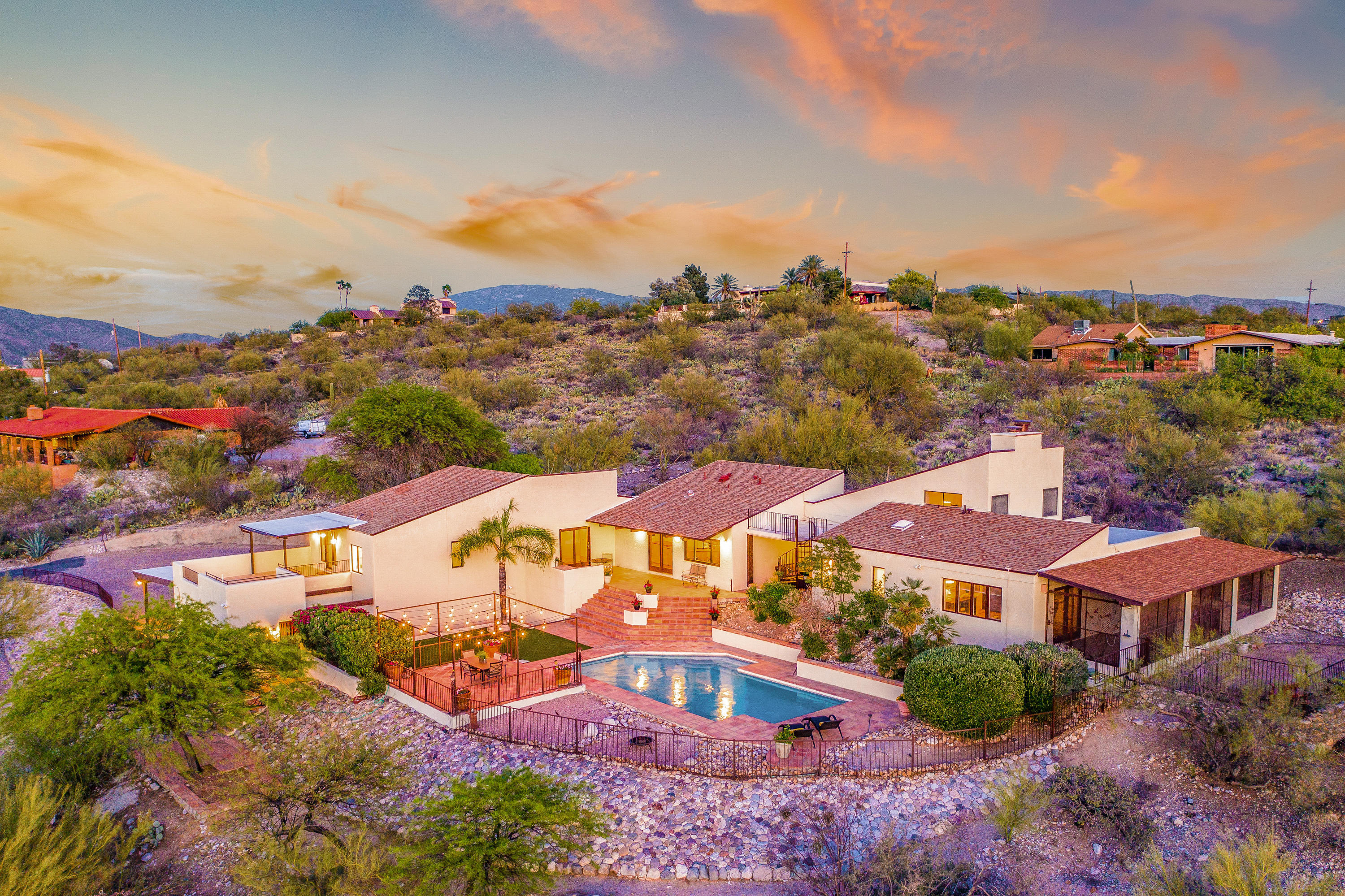 Views, Views, Views! Panoramic mountain & city views await the new owner(s) of this fine custom built home that is sculpted into a beautiful 3.3 acre hill parcel.  Enjoy 3790 Sq Ft of living space with 4 bedrooms/loft in the main house and a 1 bedroom Casita. Kitchen has gorgeous butcher block counters that look out over the backyard to some of the best views around. The master bedroom area has a sitting room & separate yard with fully enclosed raised garden.  Private 1 bedroom Casita has it's own front and back entrance and is nicely equipped with kitchenette and full bath.  Roof top decks & patios will also delight.  Horse arena area with water, tack room & tuff shed all at the bottom of the hill just inside the gated entrance.  Private hiking paths also adorn this exceptional property.