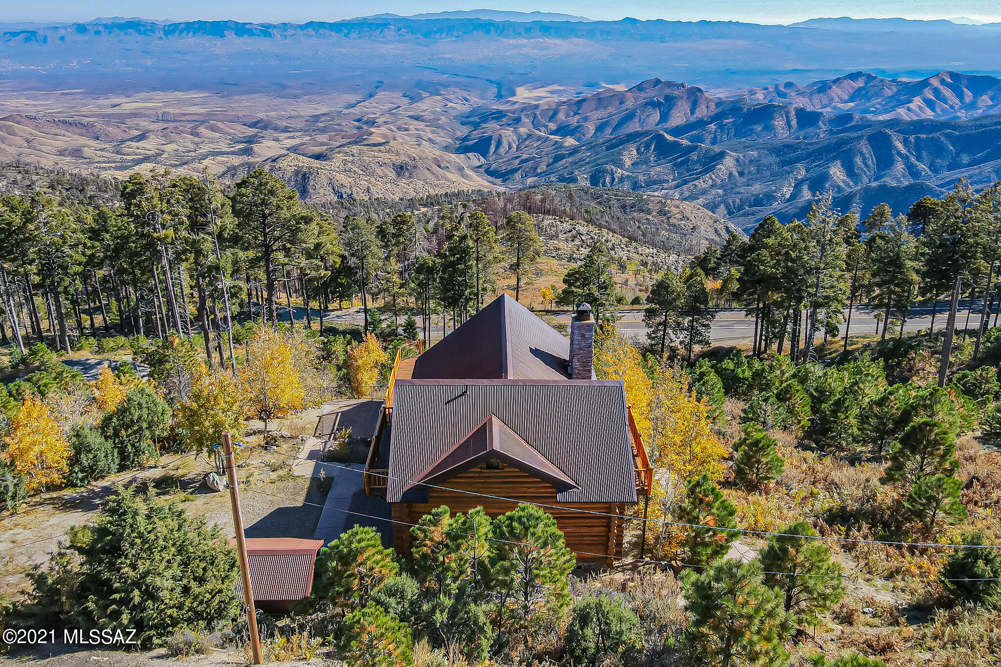 Breathtaking home on Mt. Lemmon. Custom built, one of a kind stunning home. You won't want to leave the deck off of main level with transfixing views. Great room has beautiful stone fireplace. Perfect spot to unwind. Kitchen features vintage looking red appliances. Upper level has loft, bedroom and bathroom. Lower level features bunk style sleeping, laundry, 1/2 bath, pool table and covered patio. Large storage shed with metal roof. Stunning attention to detail in this home. Truly is special!