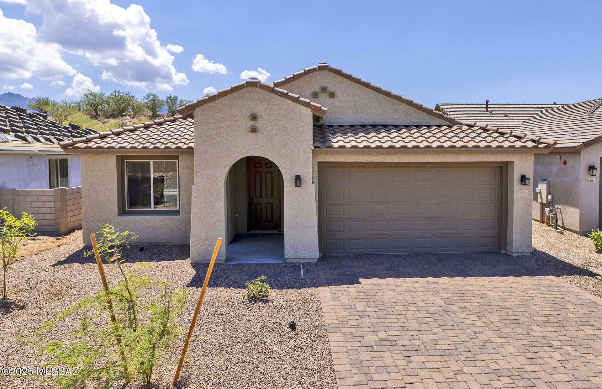 Move-in Ready August 2025. This stunning Designer home features a Spanish-style exterior with paver driveway and walkway. Inside, enjoy a Chef's Kitchen with gas cooktop, stainless Whirlpool appliances, upgraded Coastal Shaker Slate cabinets, Bianco Aspen quartz counters, and custom backsplash. Extra café cabinets offer added storage and style. Matching quartz surfaces in both bathrooms. Upgrades include 6x36 Saddle Brook Matte tile in a staggered layout. Energy-efficient touches throughout: tankless water heater, low-flow fixtures, dual-pane windows, and more.